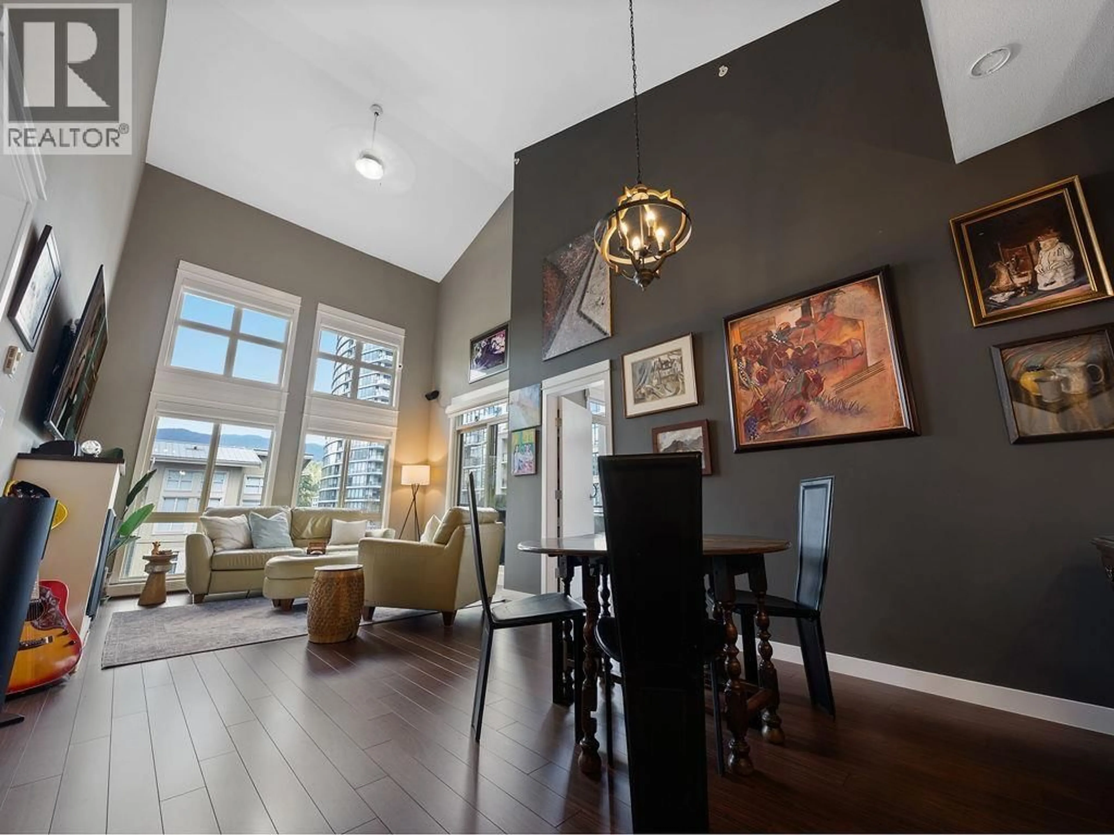 Living room with furniture, wood/laminate floor for 408 - 201 MORRISSEY ROAD, Port Moody British Columbia V3H0E5