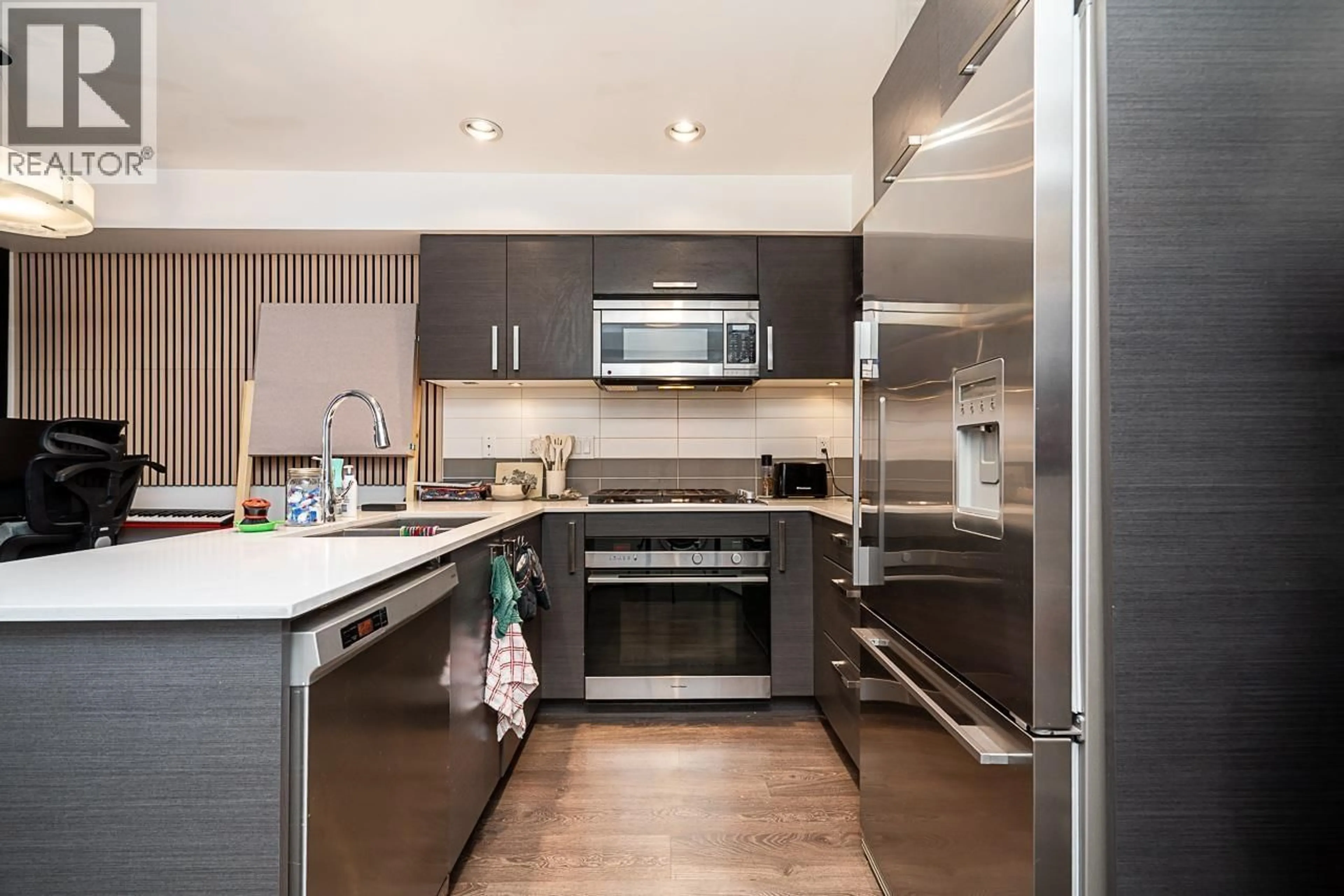 Contemporary kitchen, wood/laminate floor for 212 - 2858 4TH AVENUE, Vancouver British Columbia V6K1R2