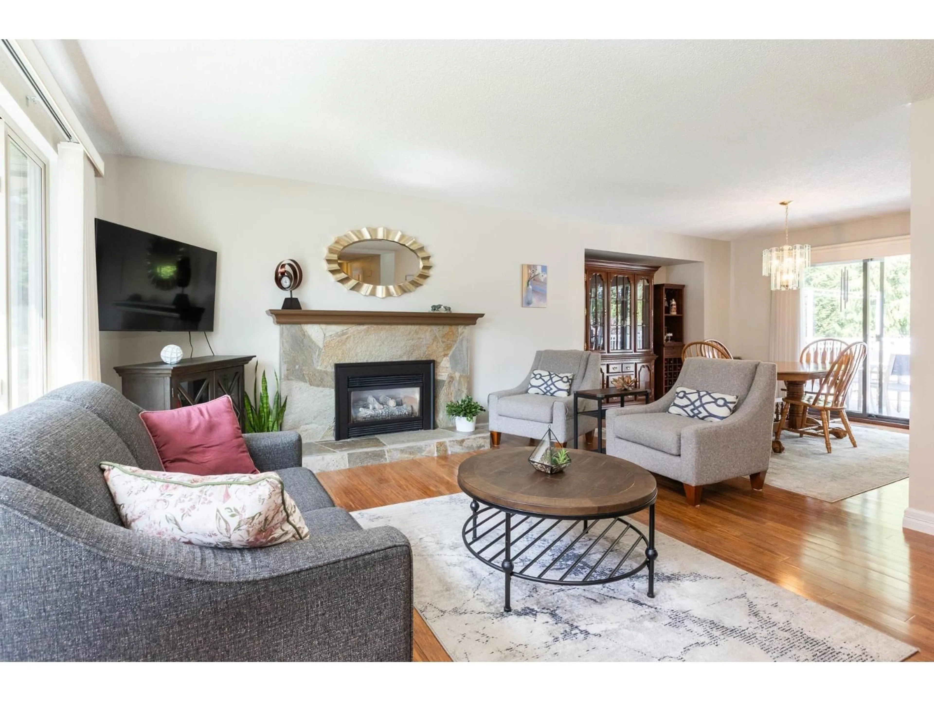Living room with furniture, wood/laminate floor for 20249 44 AVENUE, Langley British Columbia V3A6L9