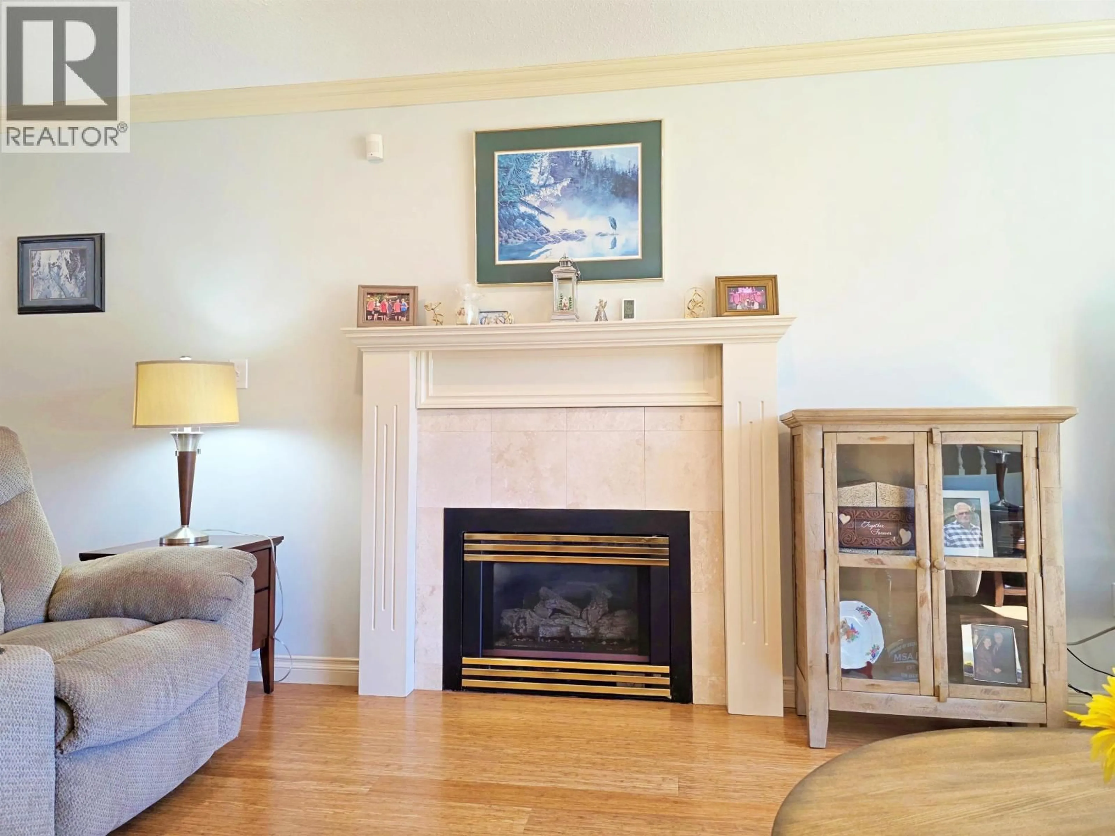 Living room with furniture, wood/laminate floor for 2020 GAMACHE ROAD, Quesnel British Columbia V2J7A8