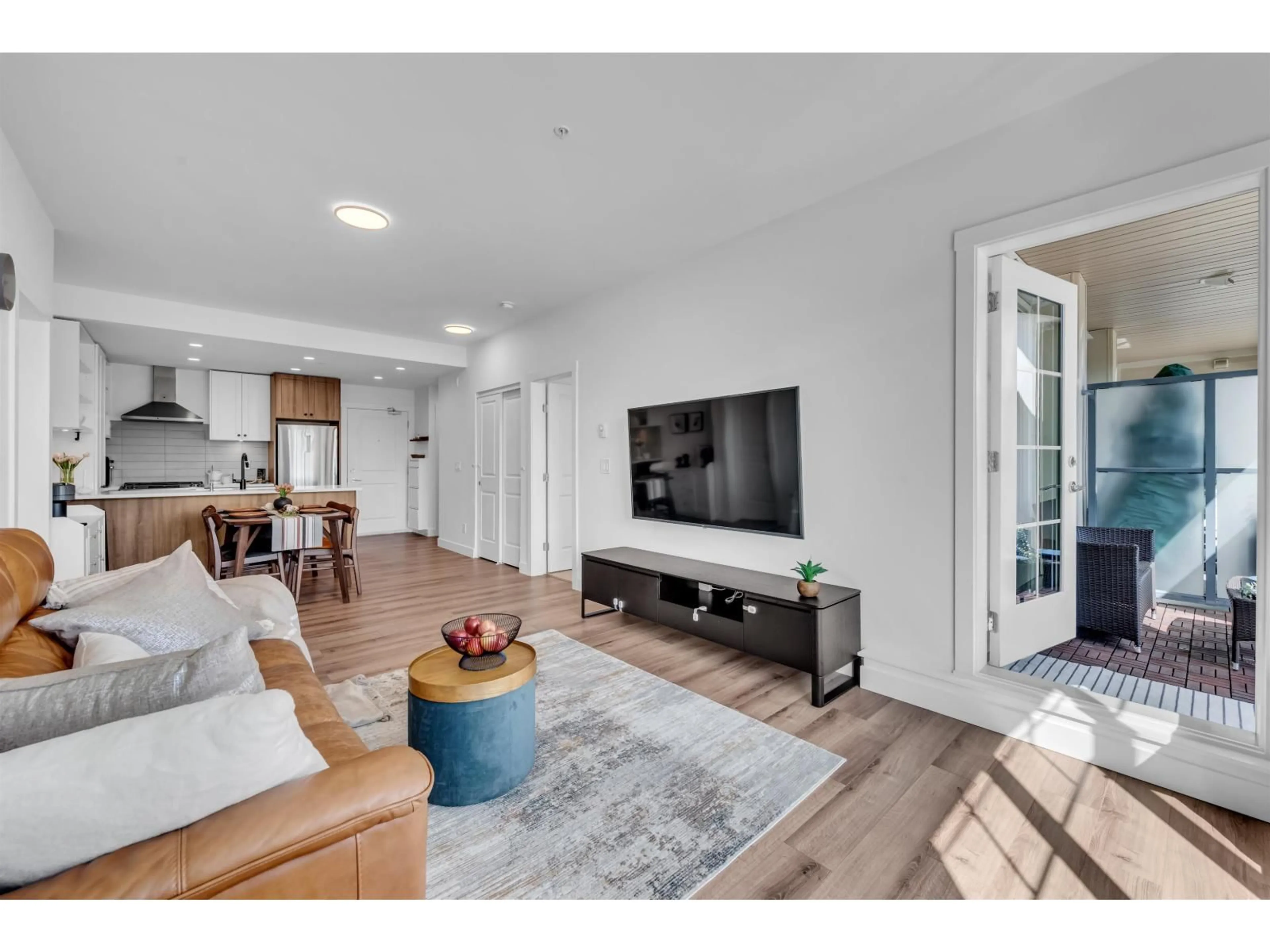 Living room with furniture, wood/laminate floor for B209 - 20487 65 AVENUE, Langley British Columbia V2Y3K6