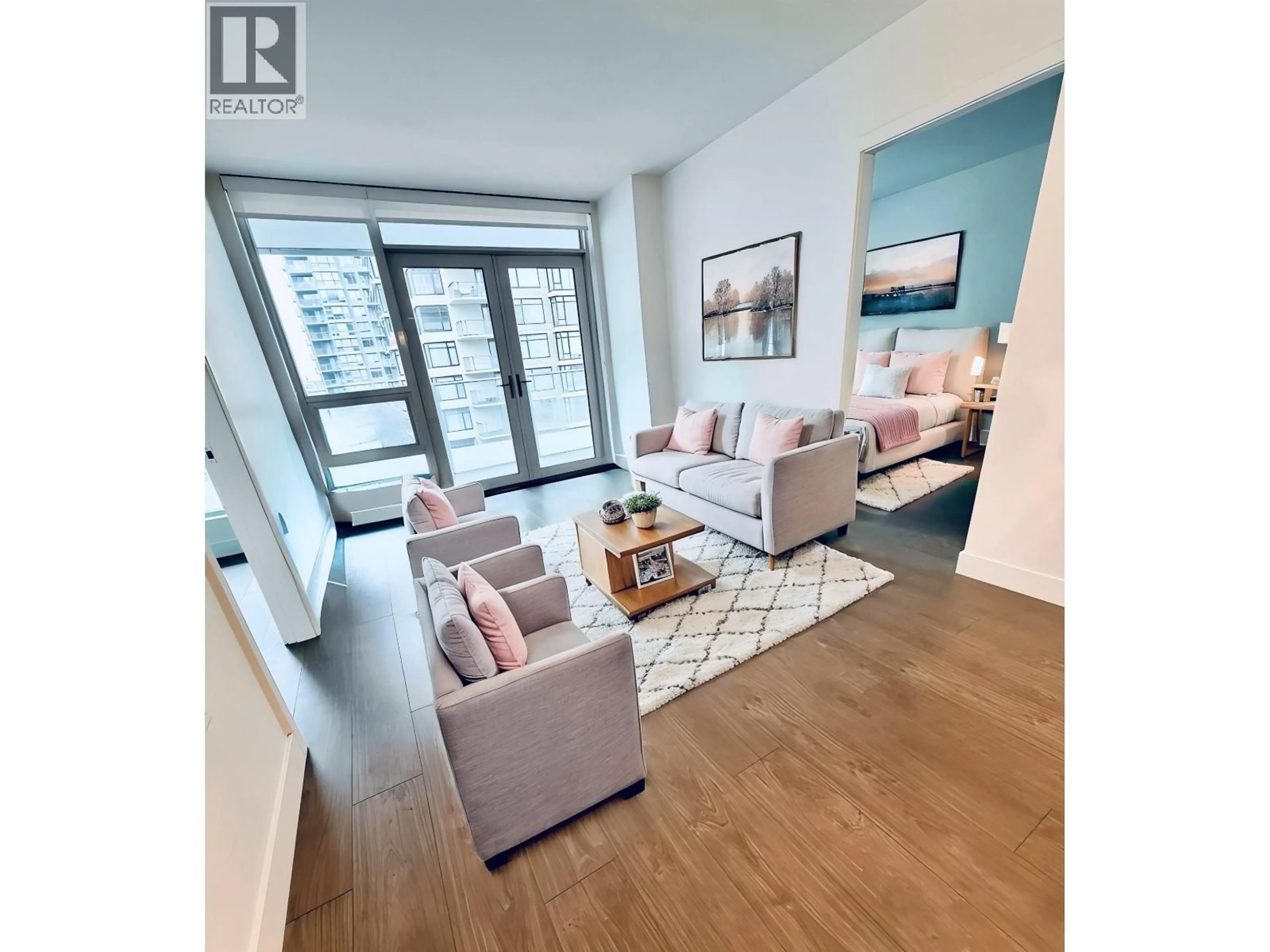 Living room with furniture, wood/laminate floor for 617 - 6328 NO. 3 ROAD, Richmond British Columbia V6Y0L6