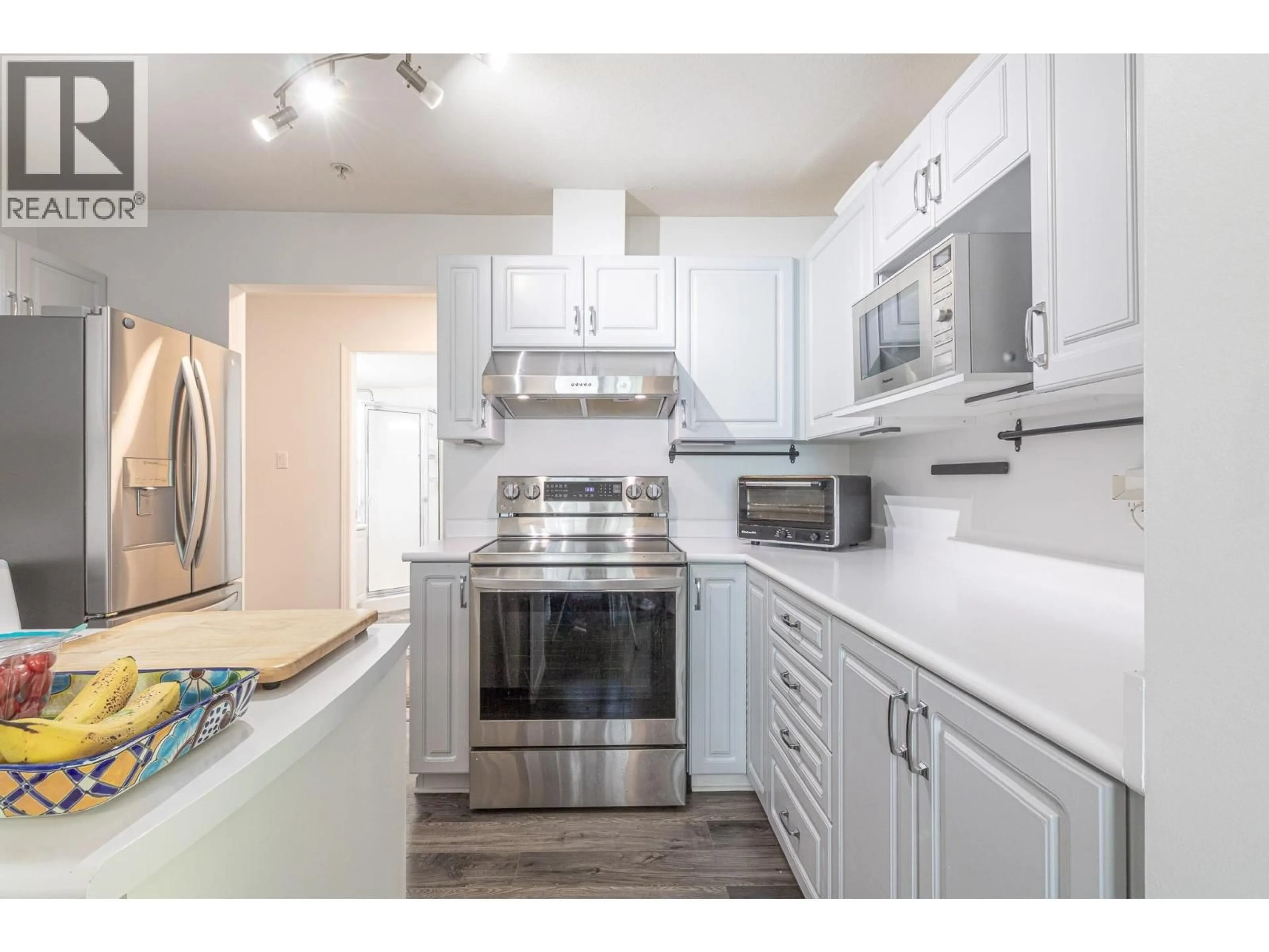 Open concept kitchen, wood/laminate floor for 205 - 12207 224 STREET, Maple Ridge British Columbia V2X6B9