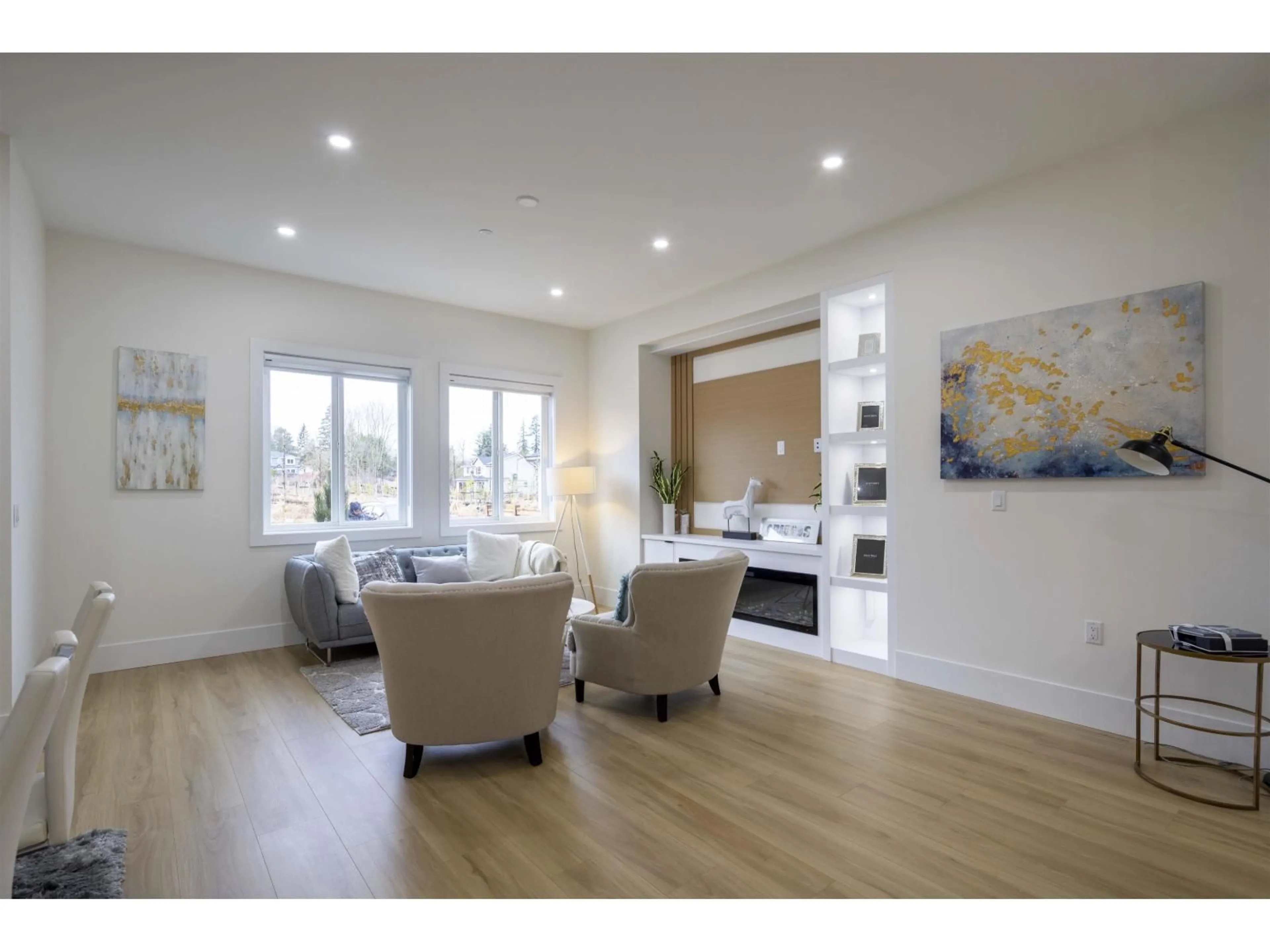 Living room with furniture, wood/laminate floor for 7707 197 STREET, Langley British Columbia V2Y3T4