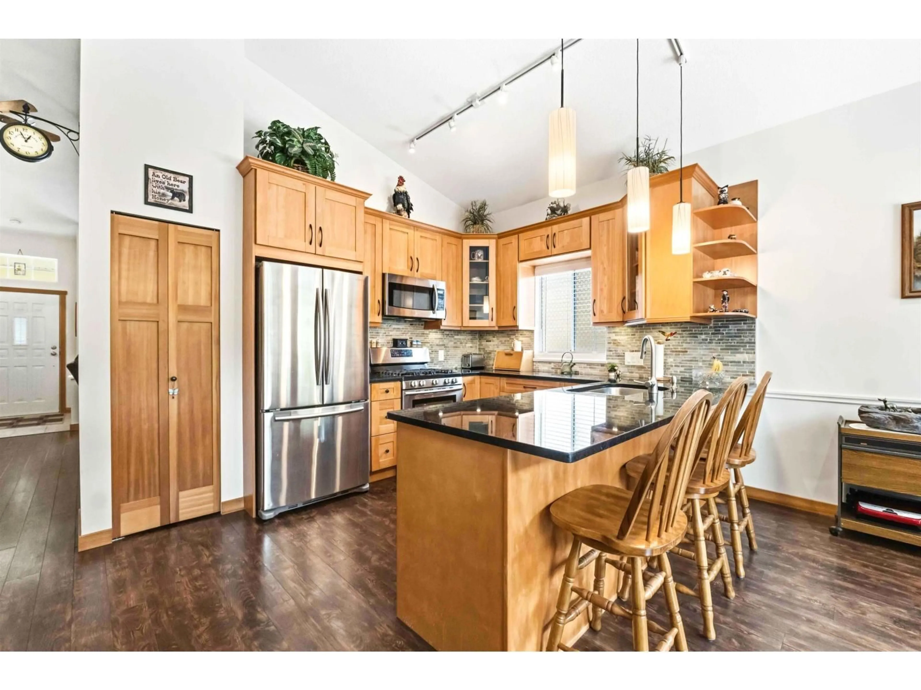 Open concept kitchen, wood/laminate floor for 56 - 9012 WALNUT GROVE DRIVE, Langley British Columbia V1M2K3