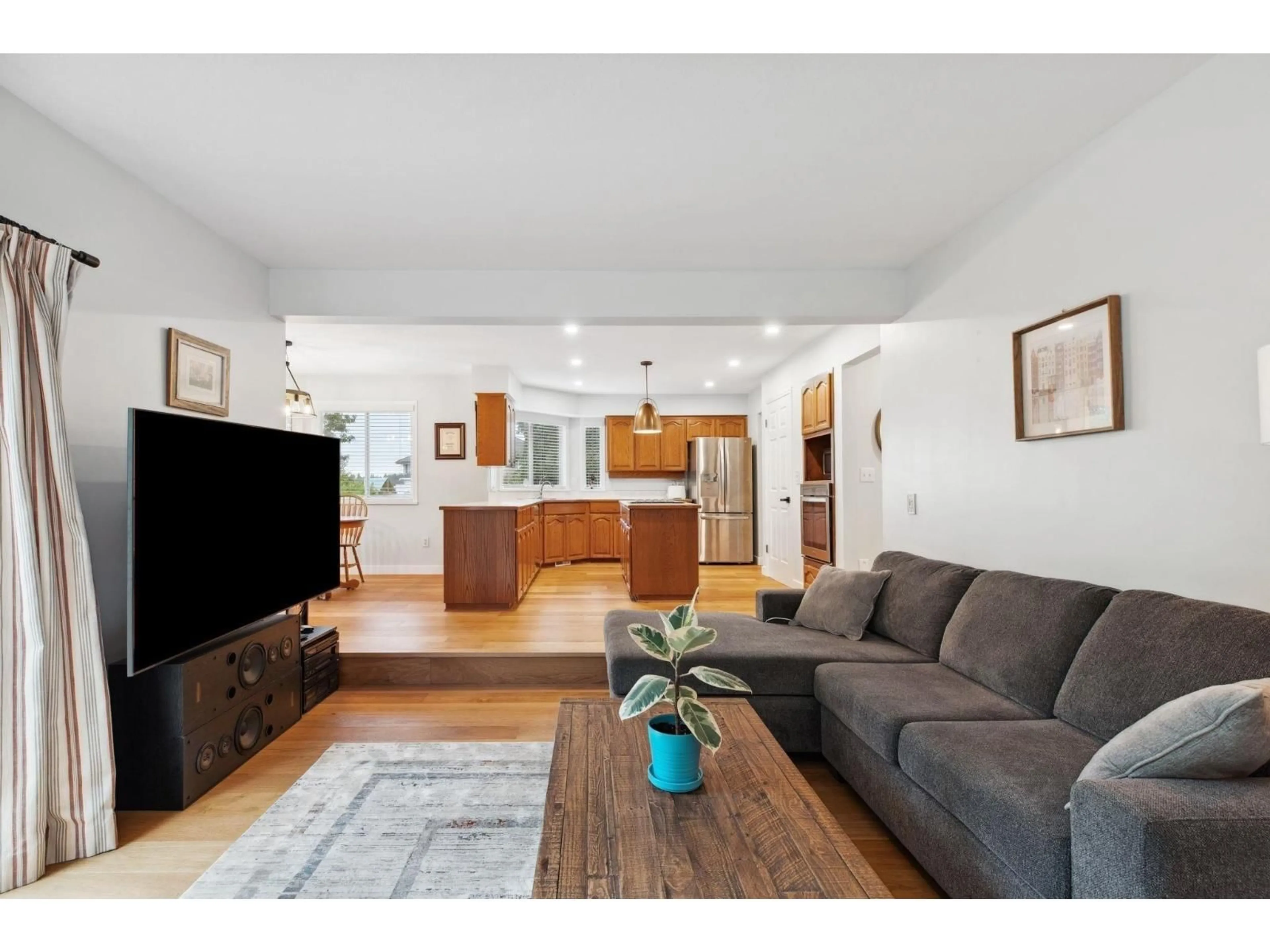 Living room with furniture, wood/laminate floor for 14370 83 AVENUE, Surrey British Columbia V3W0V7