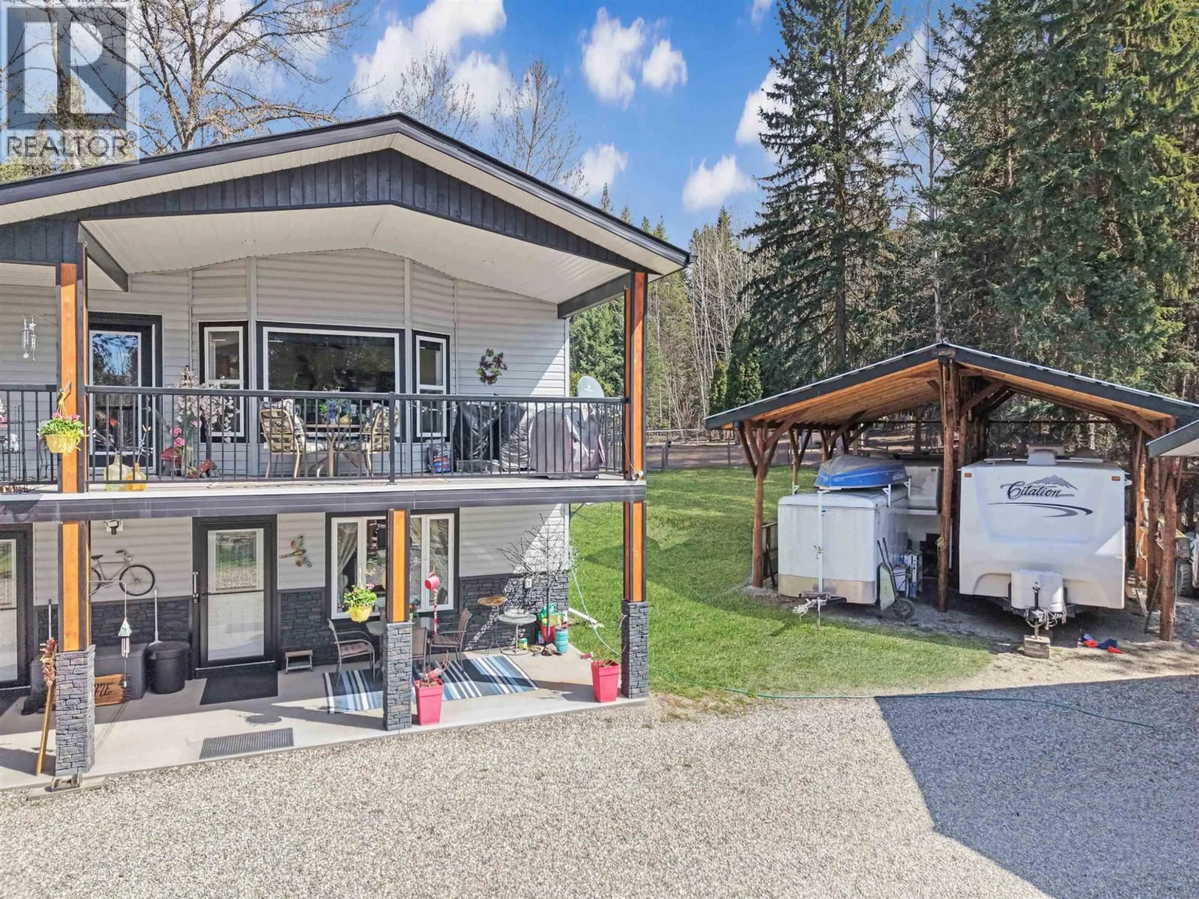 A pic from outside/outdoor area/front of a property/back of a property/a pic from drone, mountain view for 3479 LOLOFF ROAD, Quesnel British Columbia V2J6E5