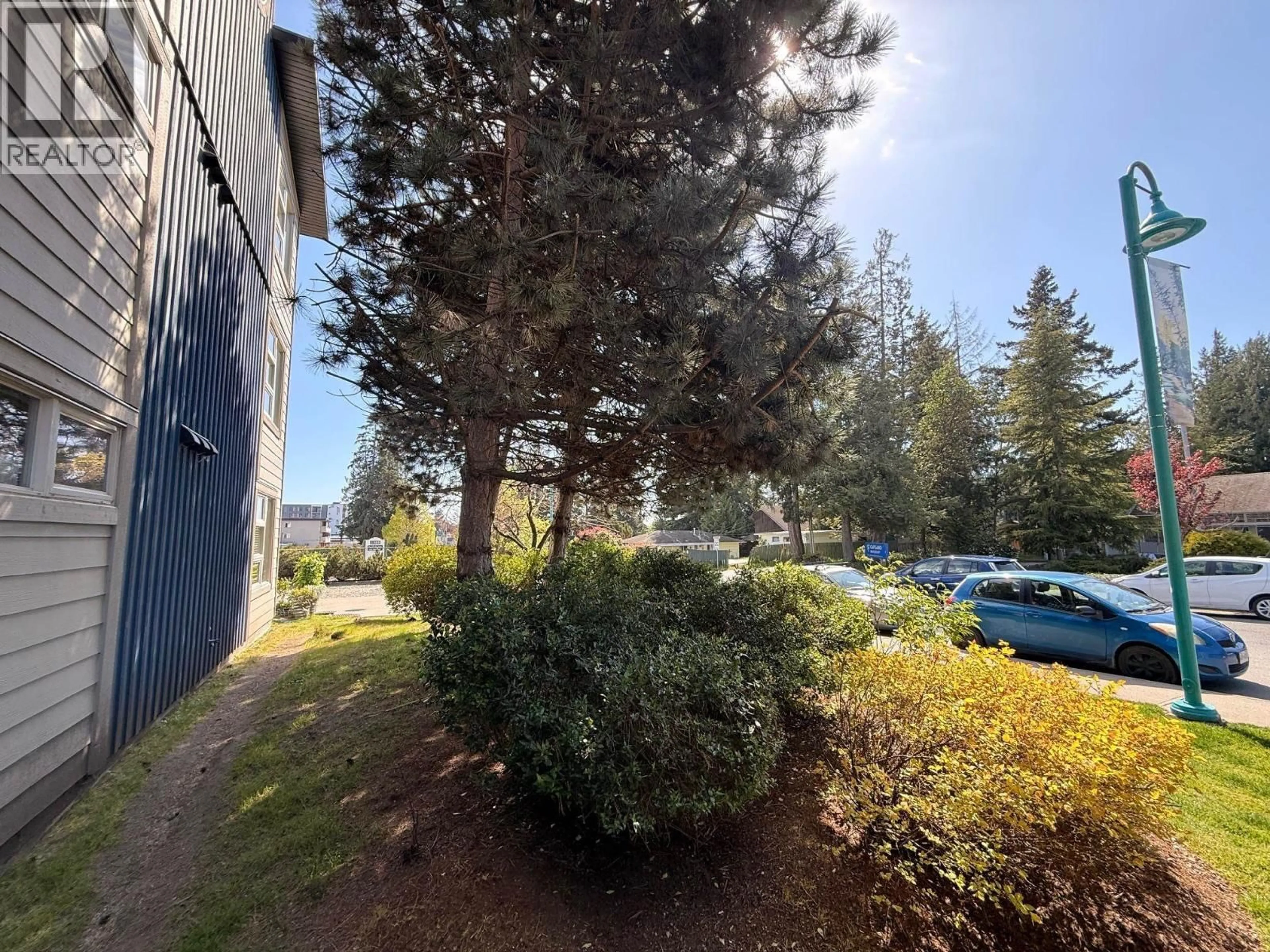 A pic from outside/outdoor area/front of a property/back of a property/a pic from drone, forest/trees view for 206 - 5604 INLET AVENUE, Sechelt British Columbia V7Z0H7