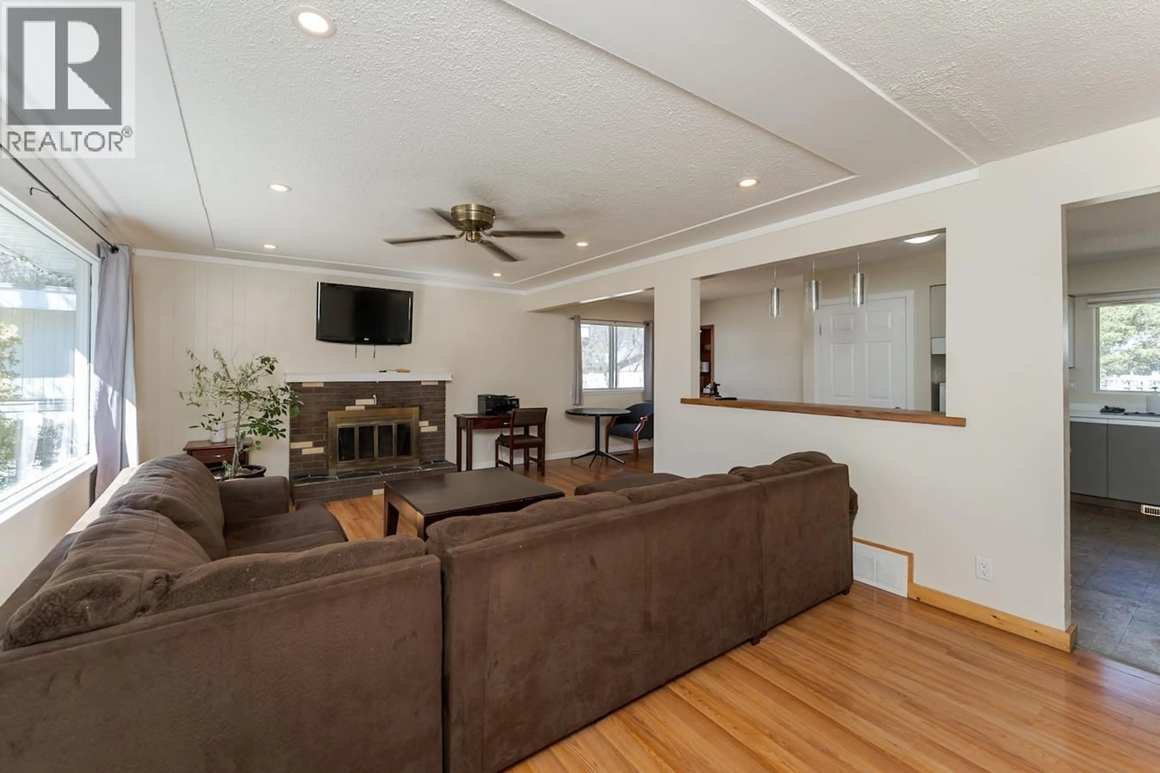 Living room with furniture, wood/laminate floor for 116 MCKENZIE AVENUE, Prince George British Columbia V2L4N4