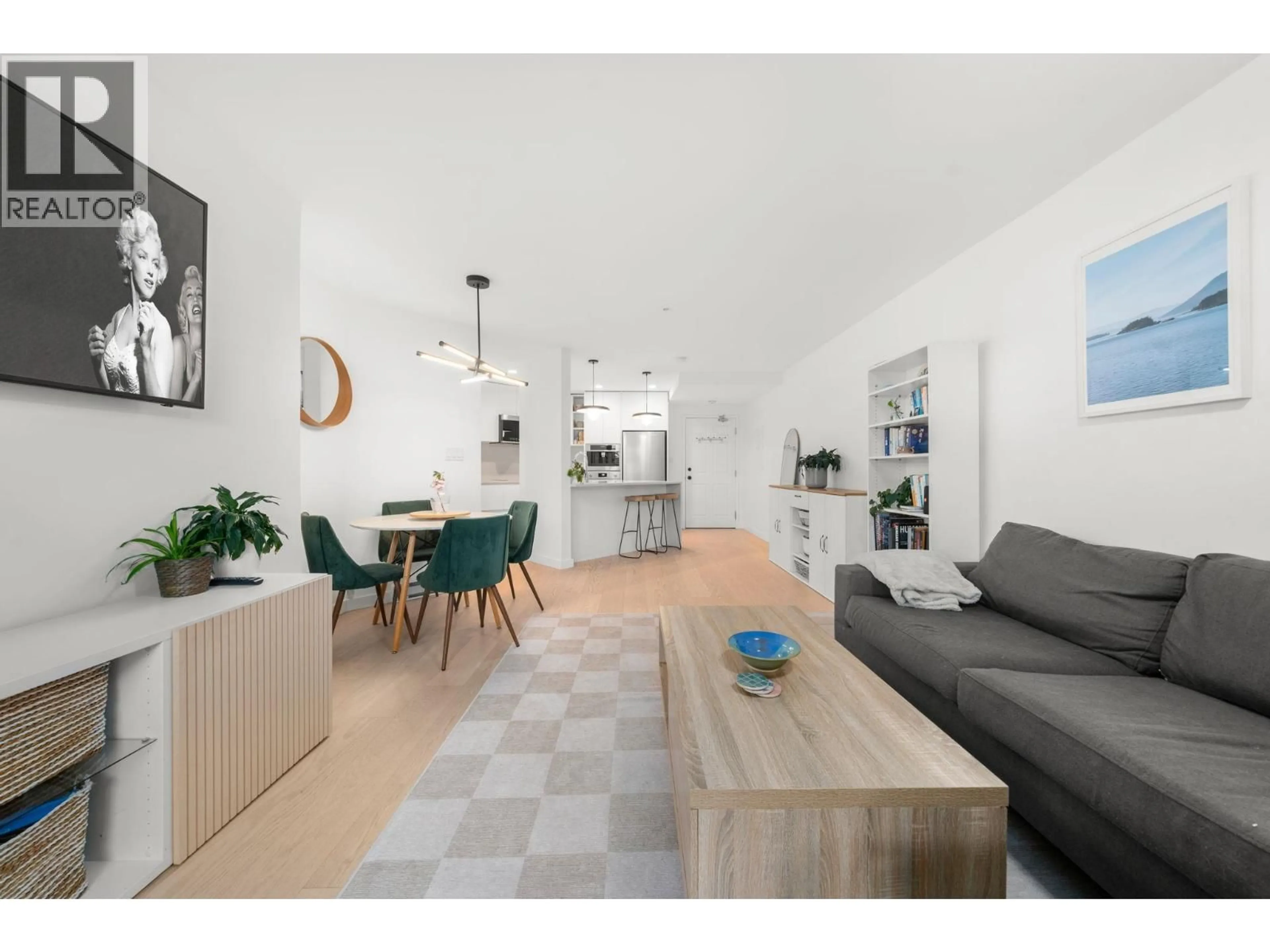 Living room with furniture, wood/laminate floor for 107 - 2023 FRANKLIN STREET, Vancouver British Columbia V5L1R4