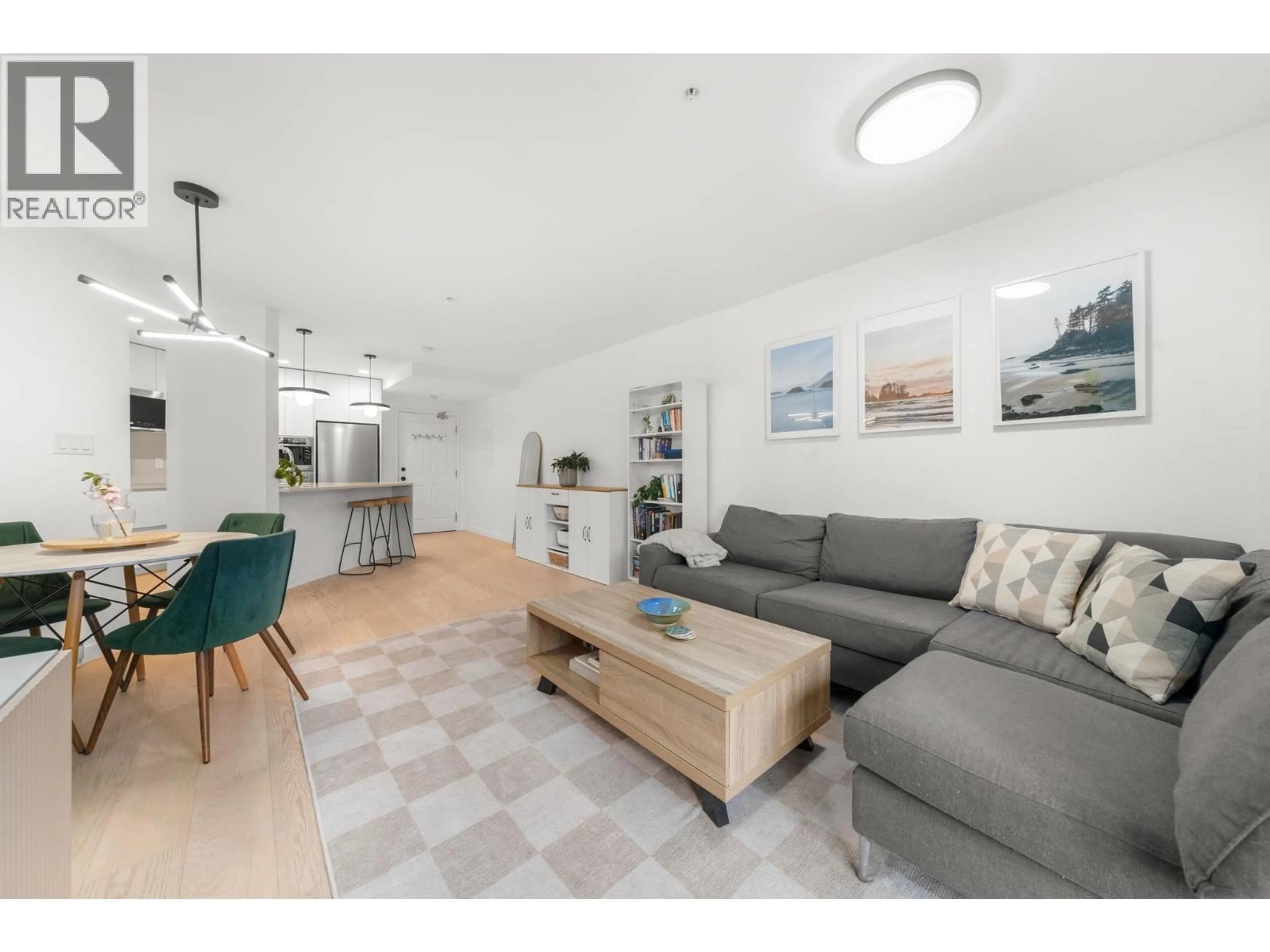 Living room with furniture, wood/laminate floor for 107 - 2023 FRANKLIN STREET, Vancouver British Columbia V5L1R4