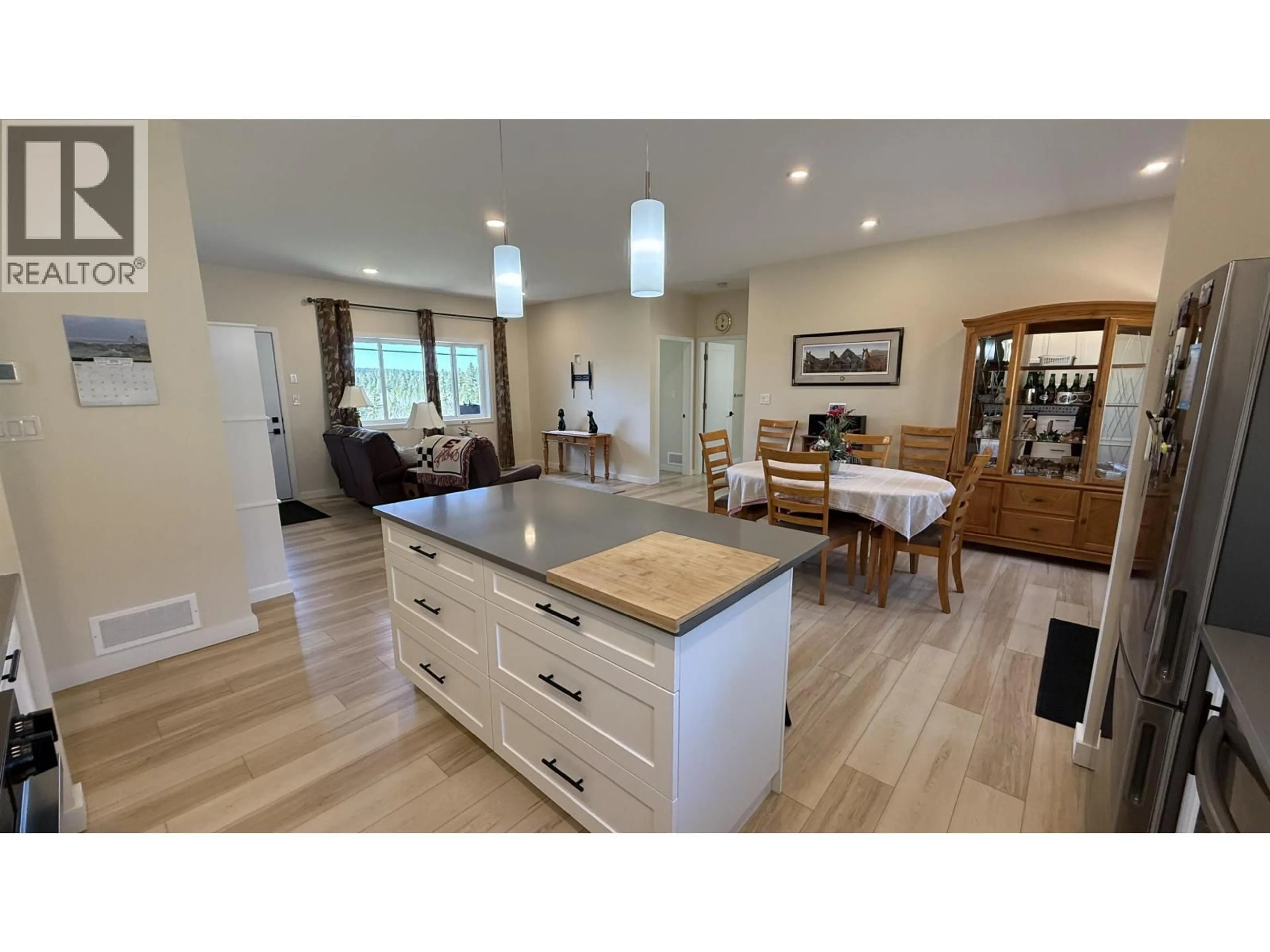 Open concept kitchen, wood/laminate floor for 3791 DODGE ROAD, Lac La Hache British Columbia V0K1T1