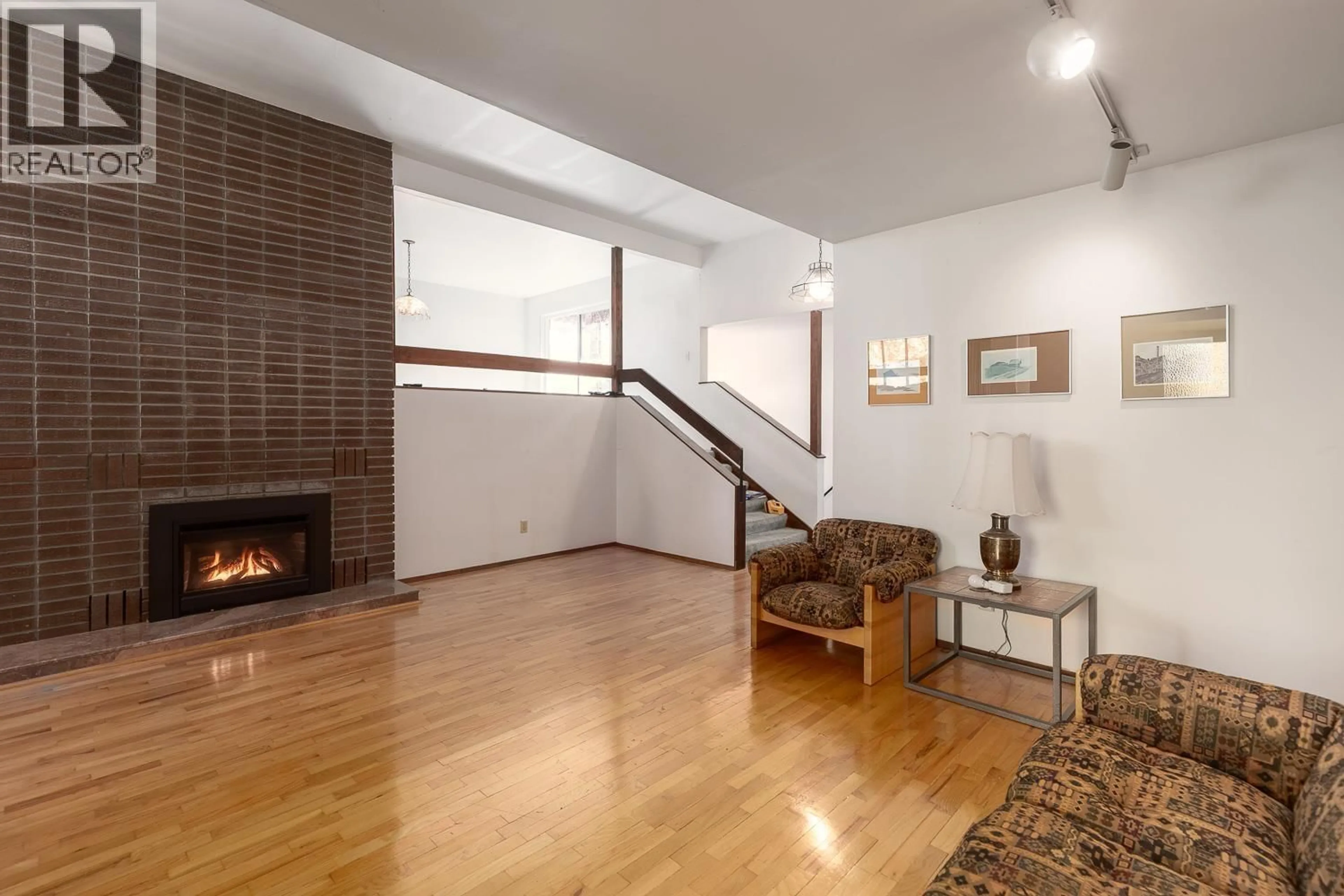 Living room with furniture, wood/laminate floor for 3186 42ND AVENUE, Vancouver British Columbia V6N3H2