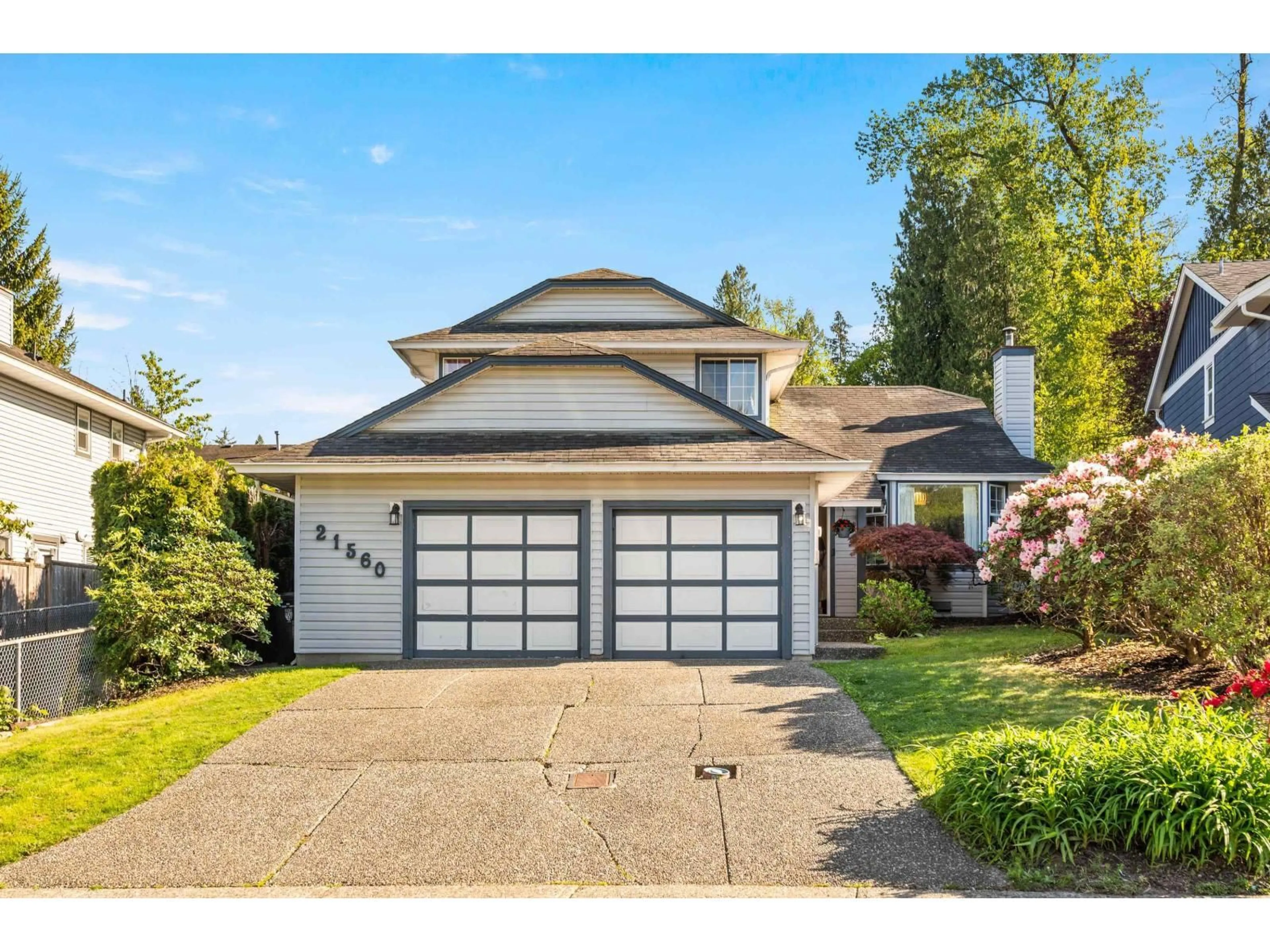 Home with vinyl exterior material, street for 21560 93B AVENUE, Langley British Columbia V1M2A3