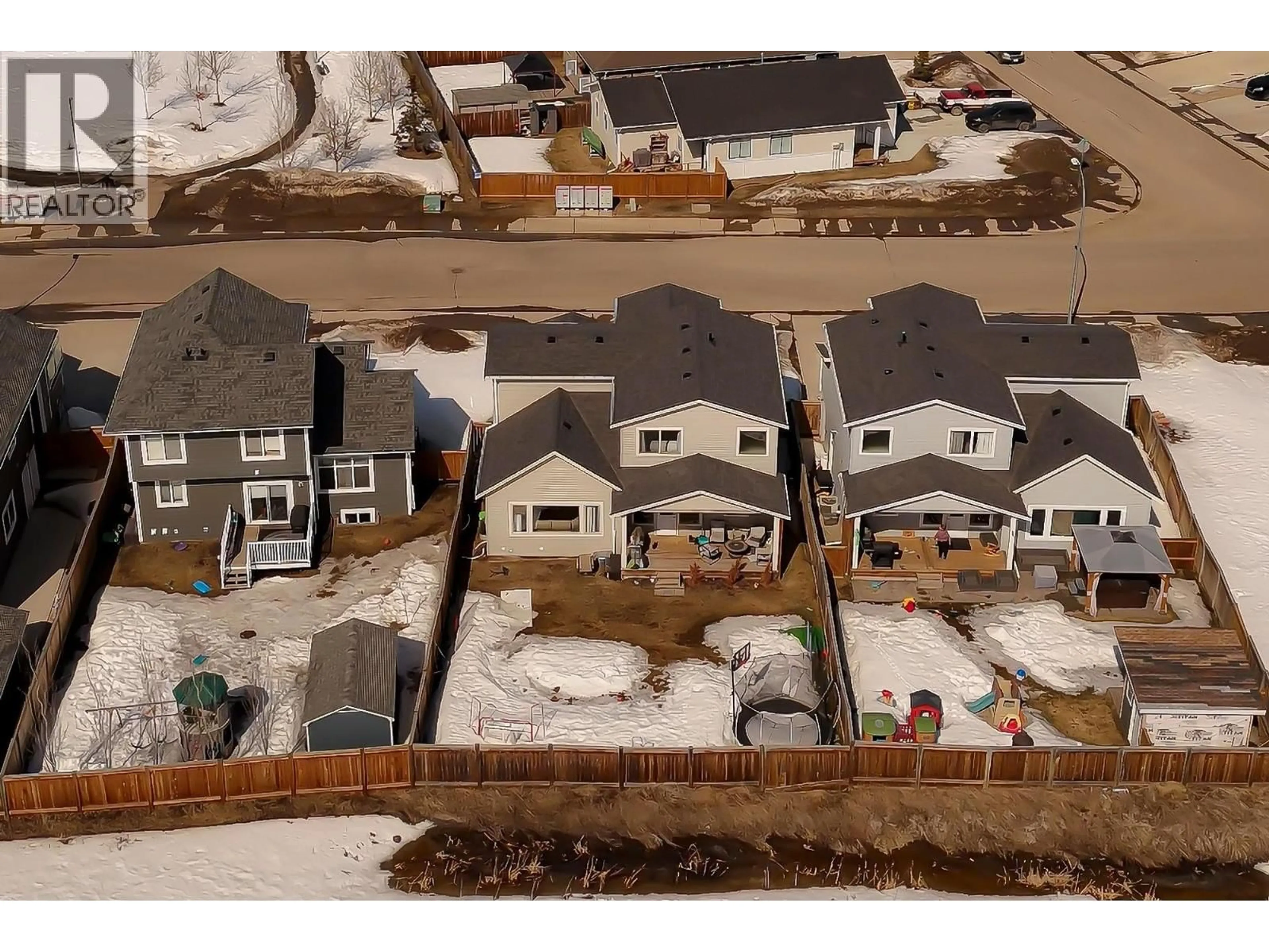 A pic from outside/outdoor area/front of a property/back of a property/a pic from drone, street for 10327 117 AVENUE, Fort St. John British Columbia V1J0K3