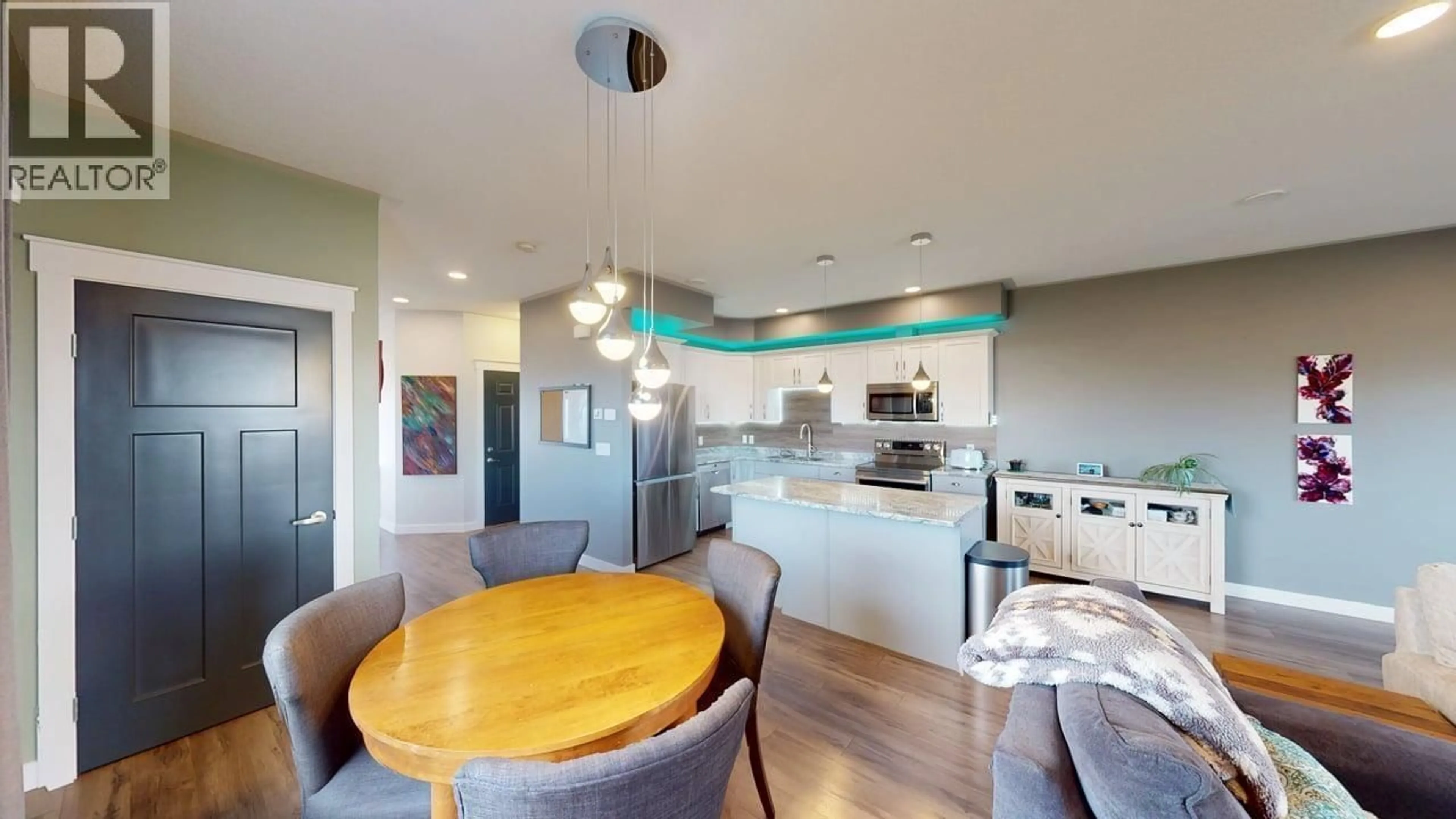 Open concept kitchen, wood/laminate floor for 10010 111 AVENUE, Fort St. John British Columbia V1J2V2