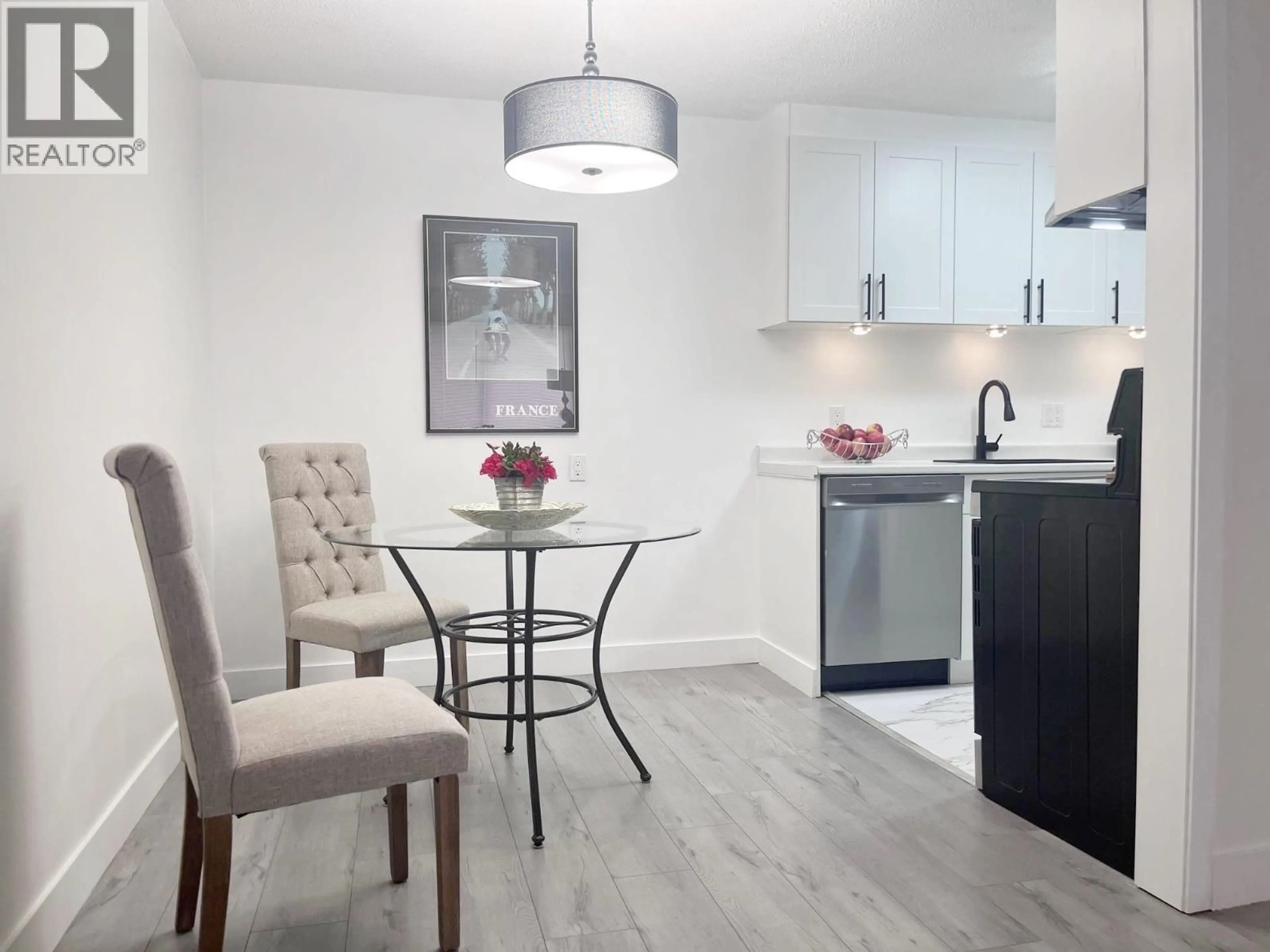 Open concept kitchen, wood/laminate floor for 212 - 780 PREMIER STREET, North Vancouver British Columbia V7J2G8