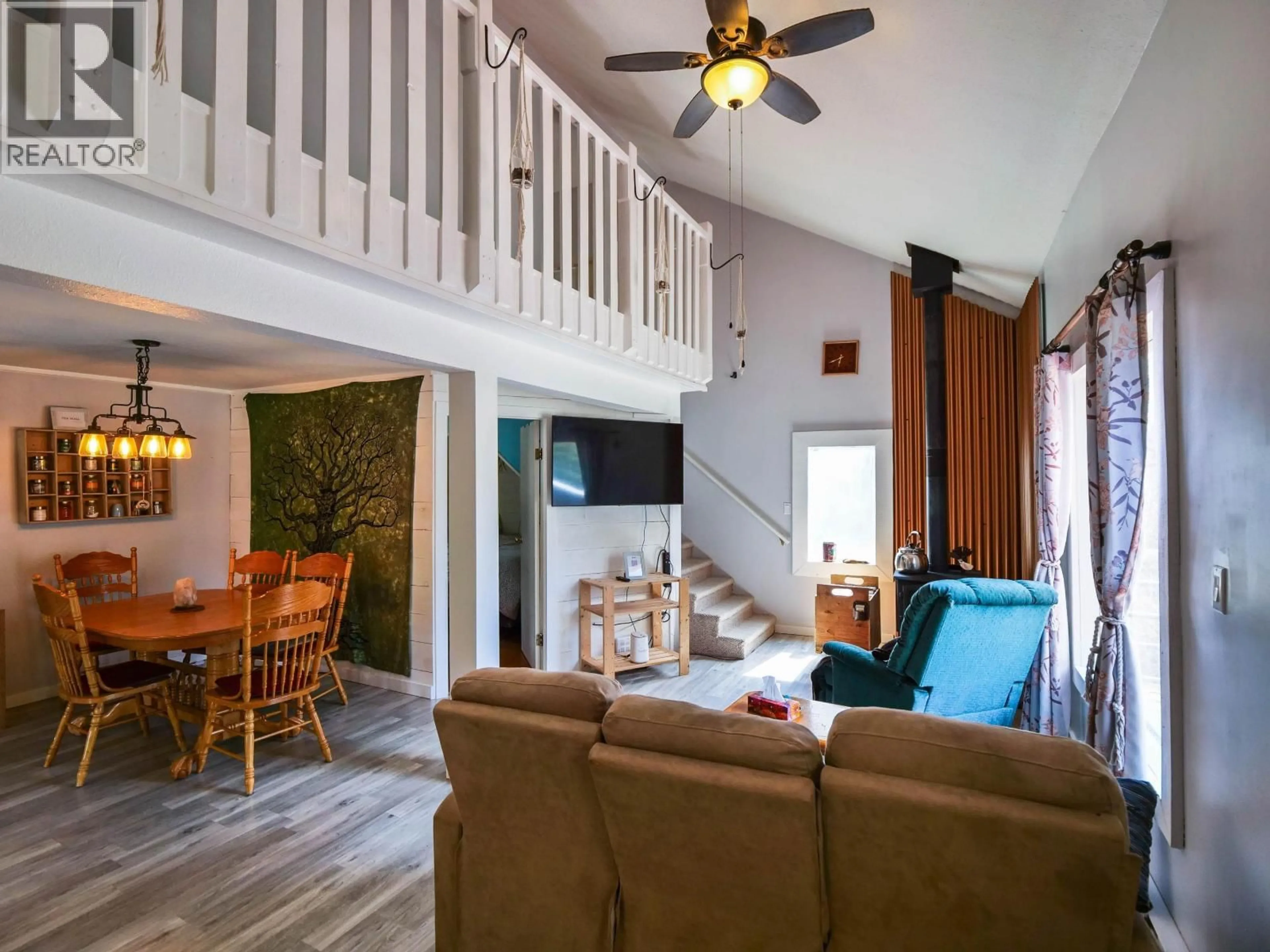 Living room with furniture, wood/laminate floor for 1168 HLADY ROAD, Quesnel British Columbia V2J6Y1