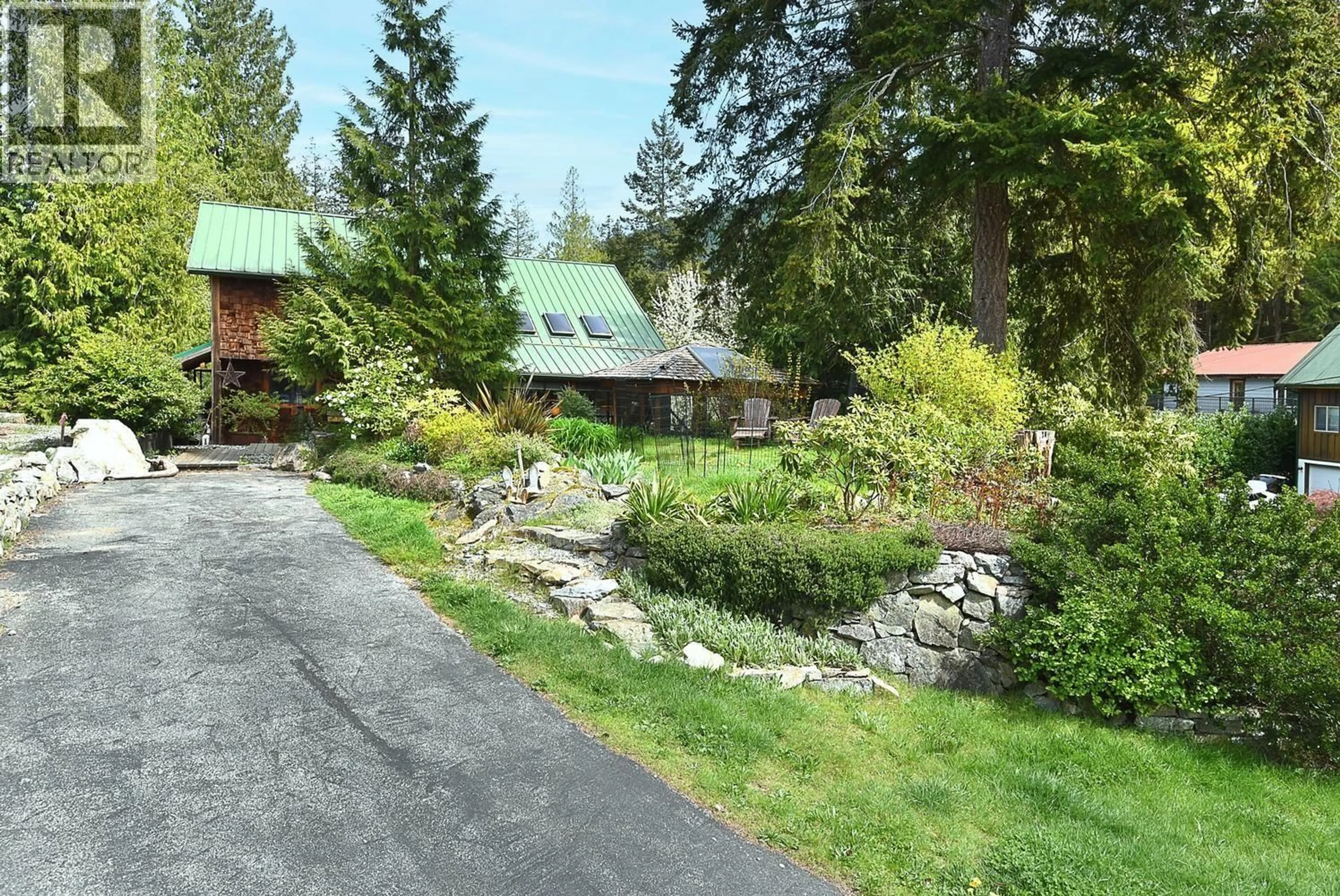 A pic from outside/outdoor area/front of a property/back of a property/a pic from drone, mountain view for 4865 BOWSPRIT DRIVE, Madeira Park British Columbia V0N2H1