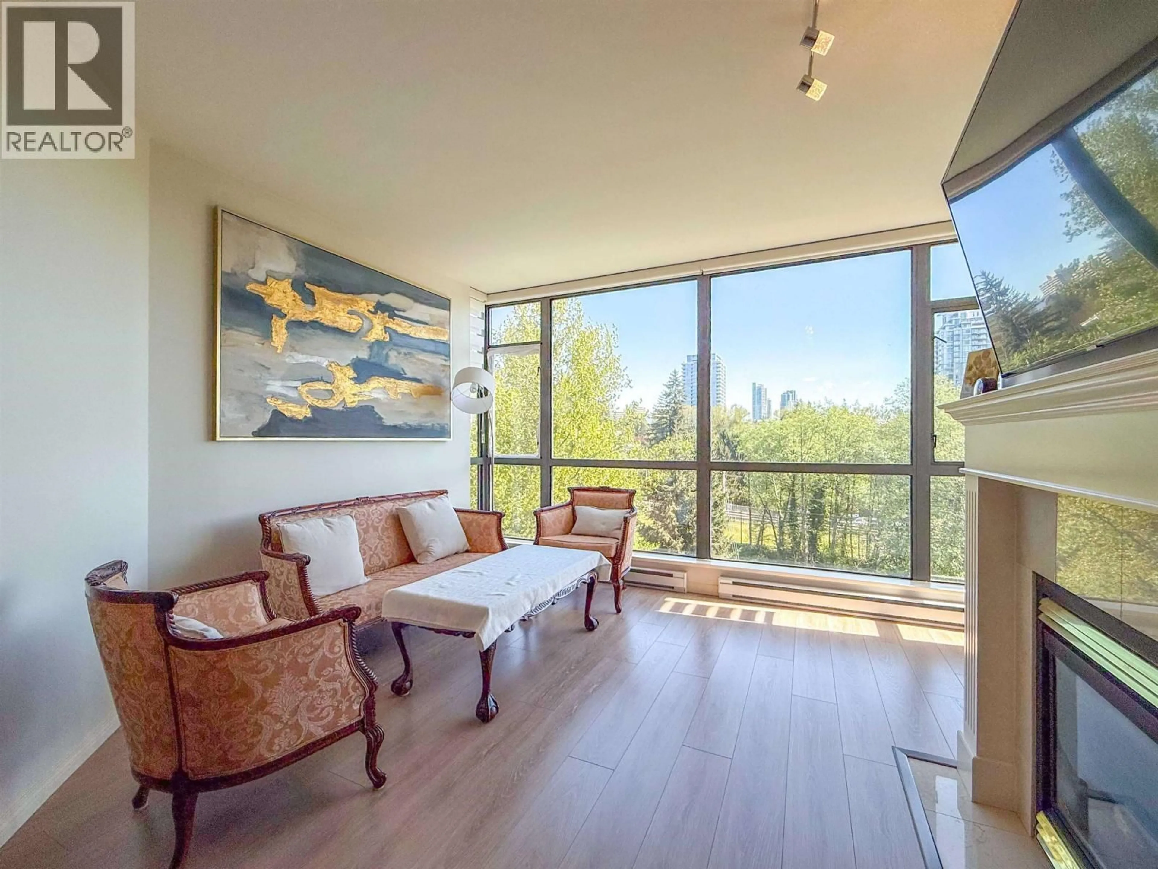 Living room with furniture, wood/laminate floor for 702 - 6837 STATION HILL DRIVE, Burnaby British Columbia V3N5B7