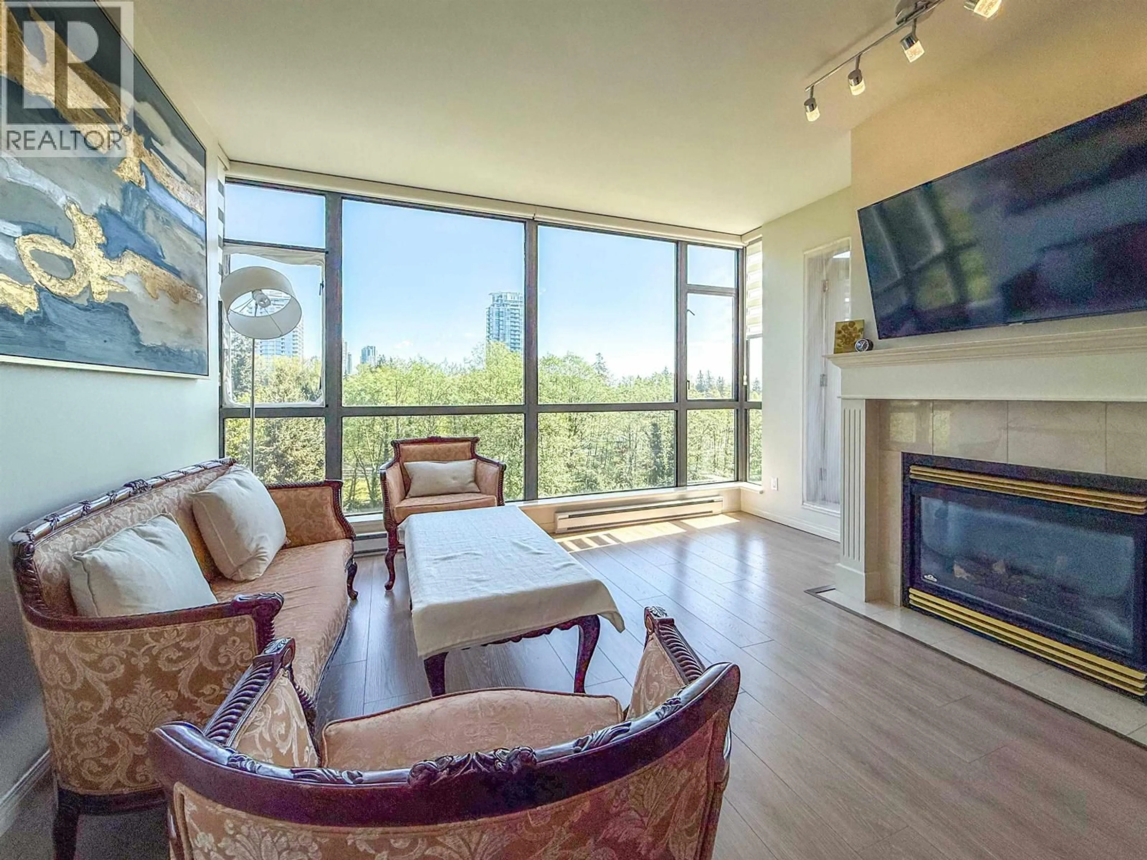 Living room with furniture, wood/laminate floor for 702 - 6837 STATION HILL DRIVE, Burnaby British Columbia V3N5B7