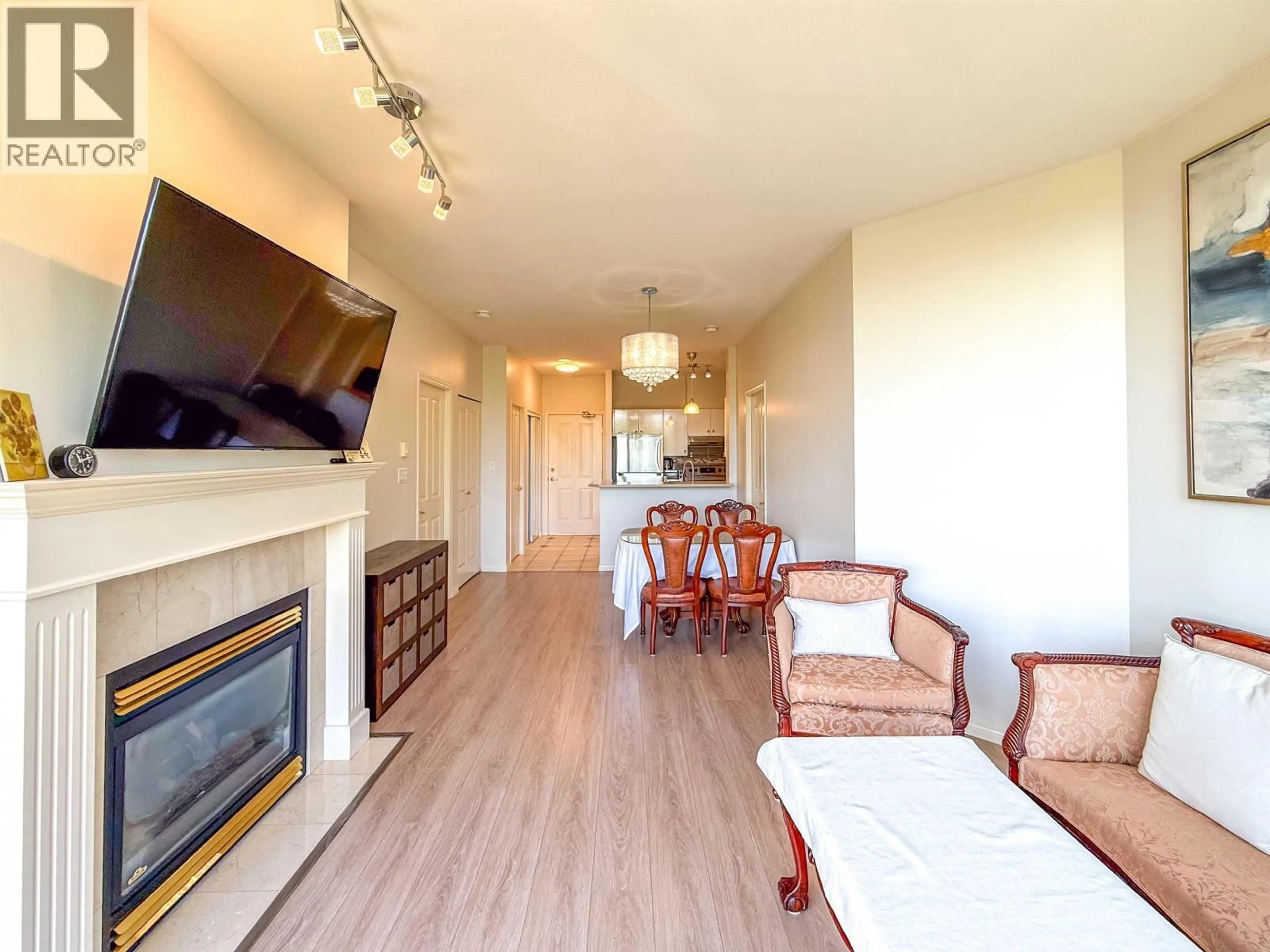 Living room with furniture, wood/laminate floor for 702 - 6837 STATION HILL DRIVE, Burnaby British Columbia V3N5B7