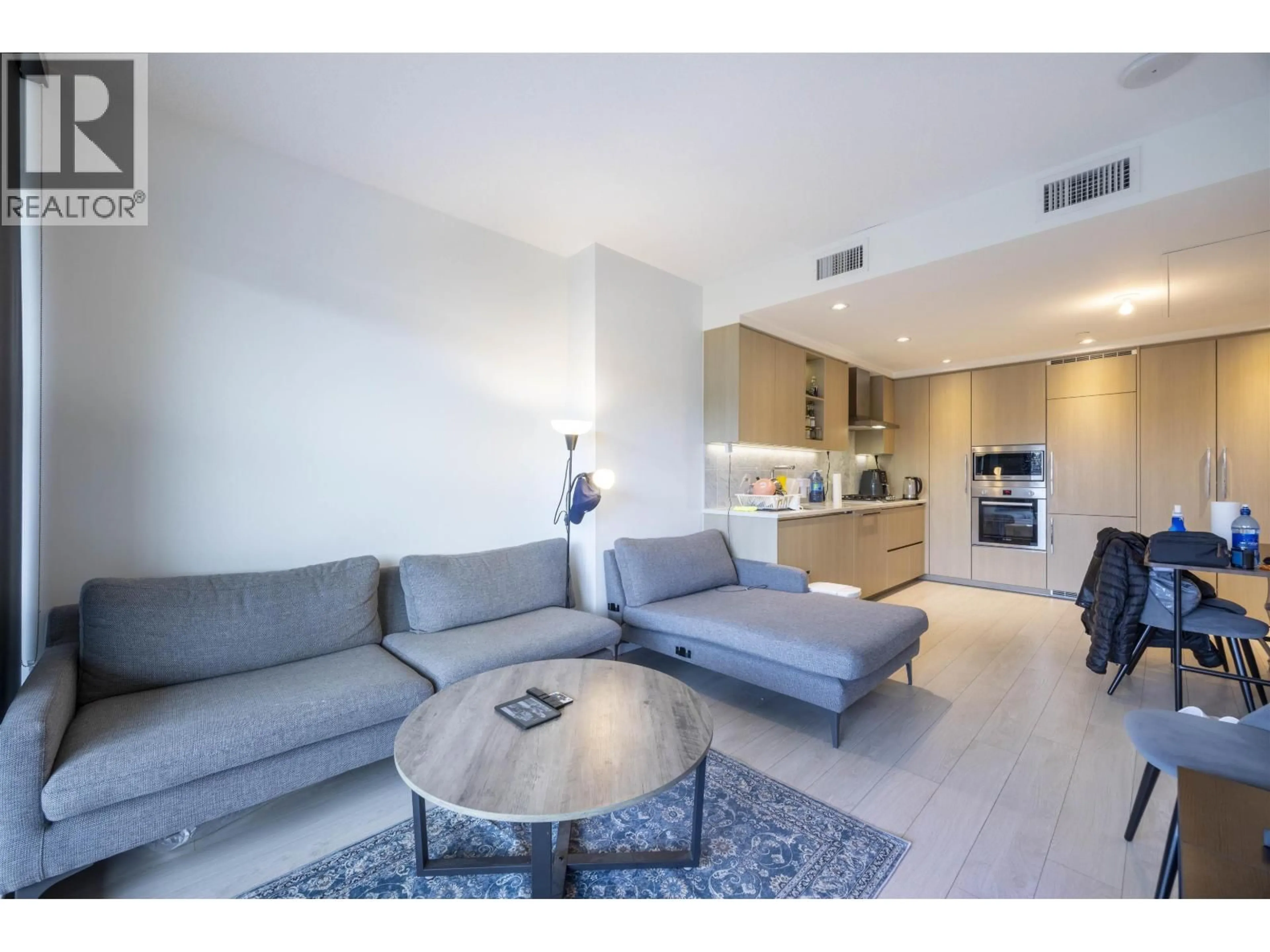 Living room with furniture, unknown for 607 - 4720 LOUGHEED HIGHWAY, Burnaby British Columbia V5C0M8