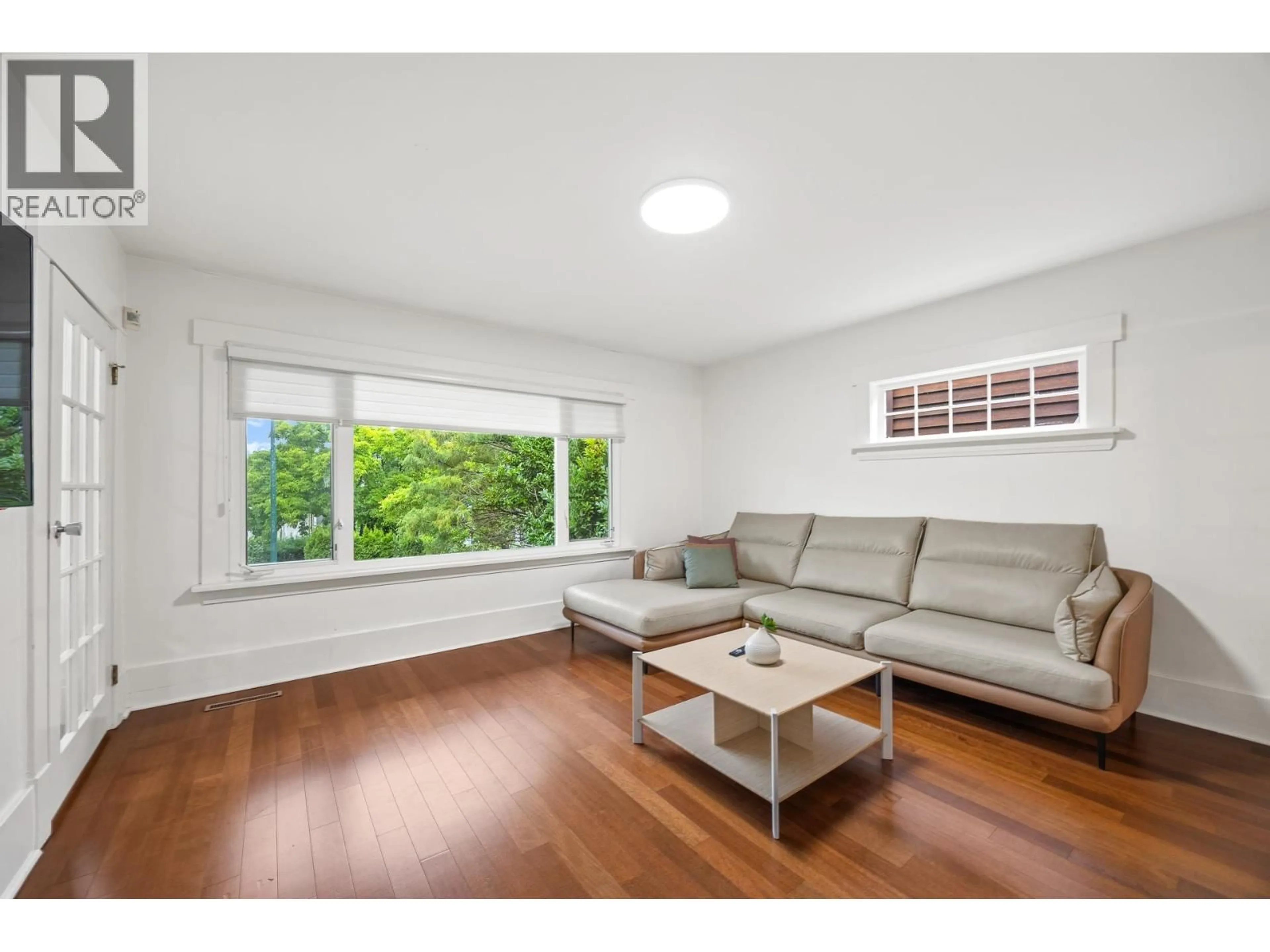 Living room with furniture, wood/laminate floor for 3276 21ST AVENUE, Vancouver British Columbia V6L1L2