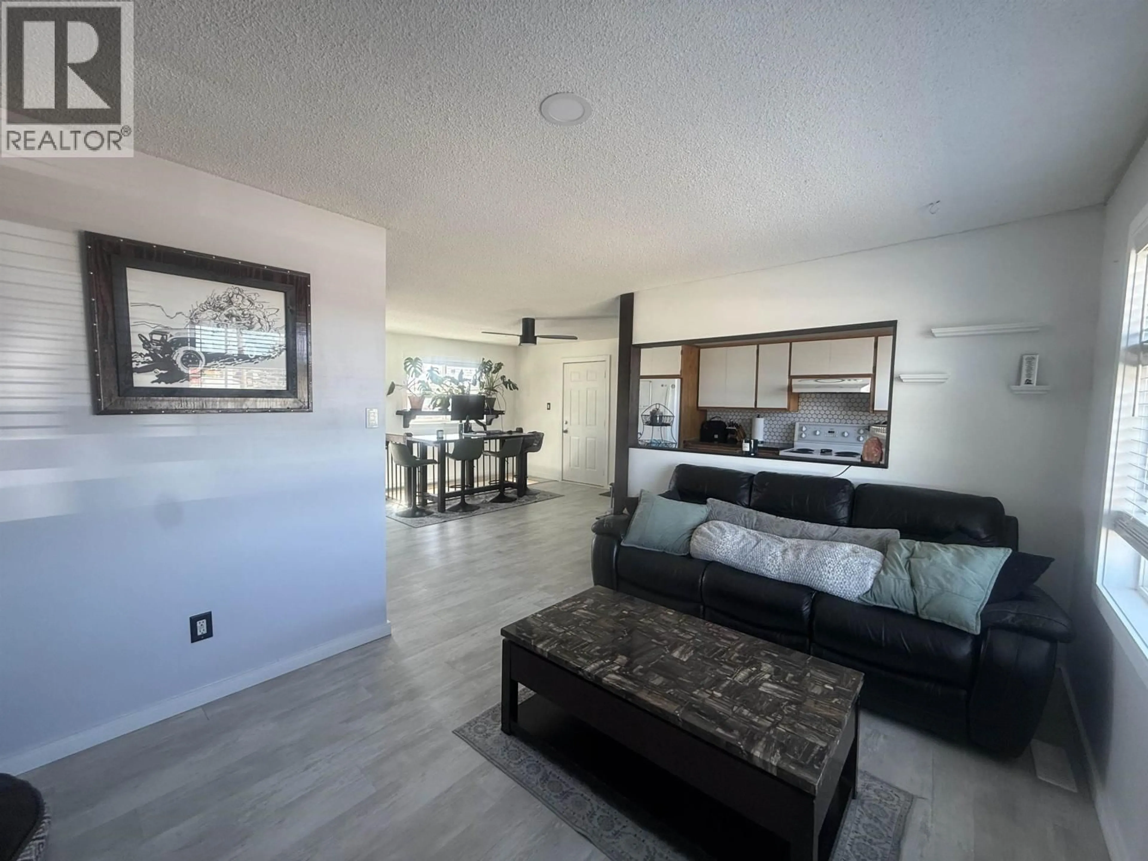 Living room with furniture, unknown for 8511 98 AVENUE, Fort St. John British Columbia V1J1P6