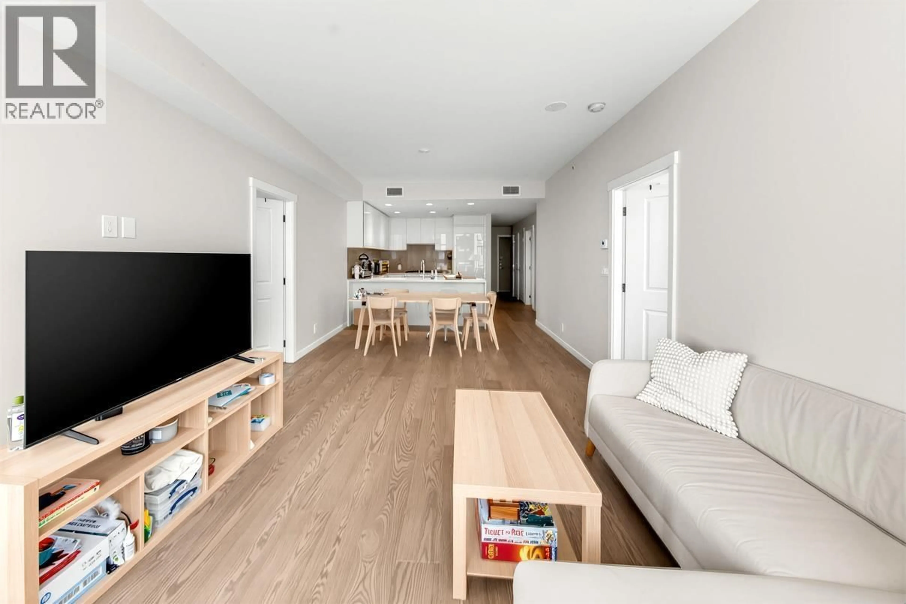Living room with furniture, wood/laminate floor for 408 - 3533 ROSS DRIVE, Vancouver British Columbia V6S0L3