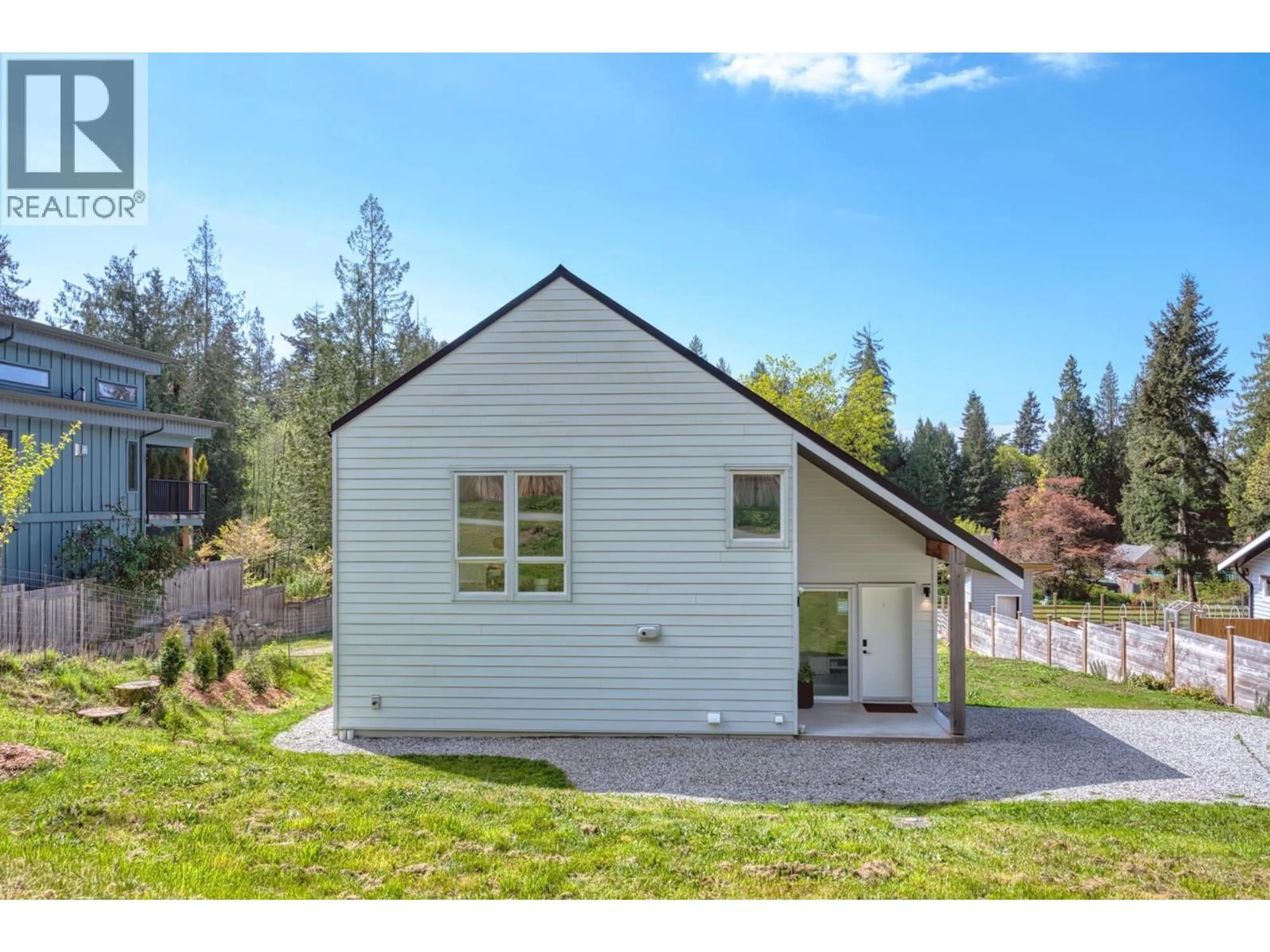 Home with vinyl exterior material, street for 3477 SPRUCE ROAD, Roberts Creek British Columbia V0N2W2