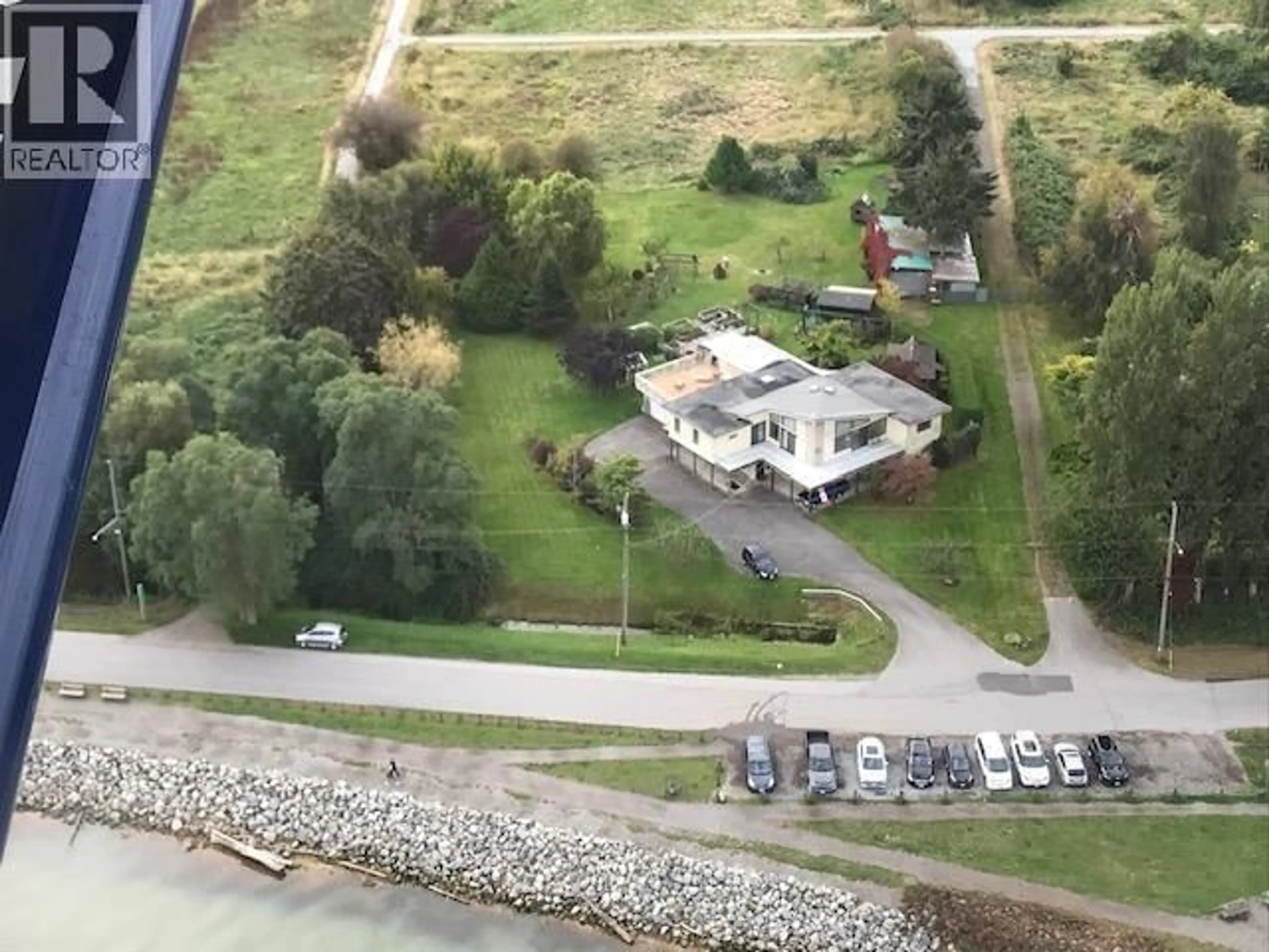 A pic from outside/outdoor area/front of a property/back of a property/a pic from drone, water/lake/river/ocean view for 2860 RIVER ROAD, Richmond British Columbia V7C1A1