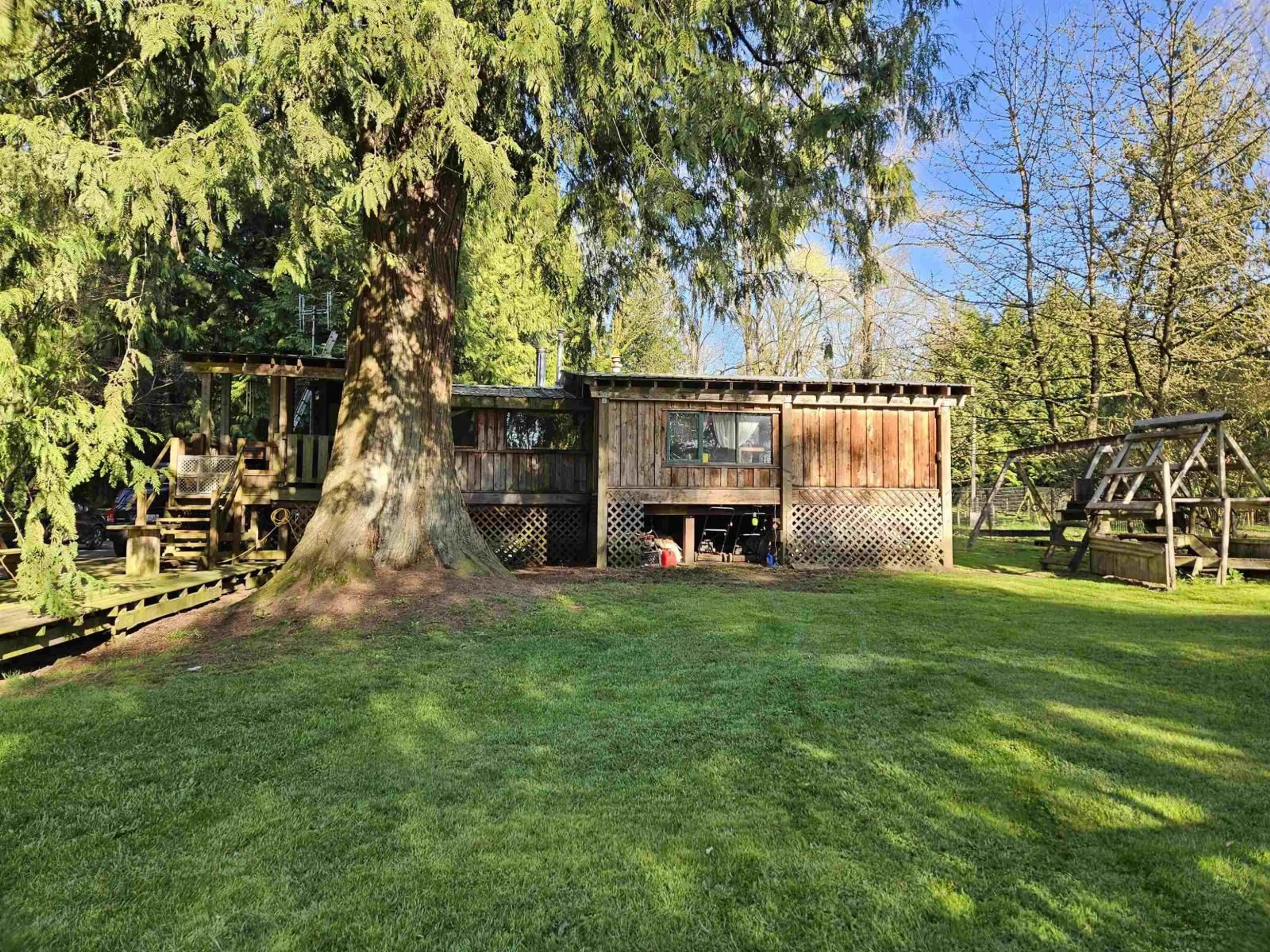 A pic from outside/outdoor area/front of a property/back of a property/a pic from drone, forest/trees view for 25080 4 AVENUE, Langley British Columbia V4W2H3