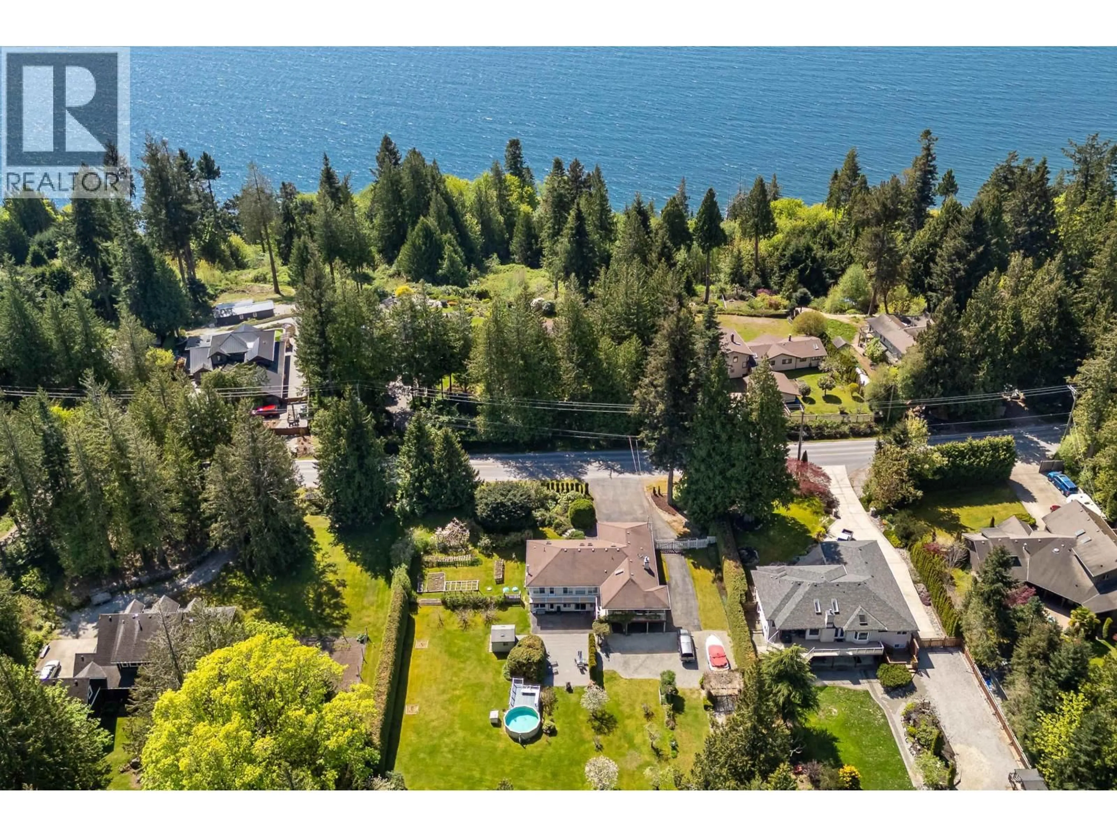 A pic from outside/outdoor area/front of a property/back of a property/a pic from drone, water/lake/river/ocean view for 7904 REDROOFFS ROAD, Halfmoon Bay British Columbia V7Z1A4