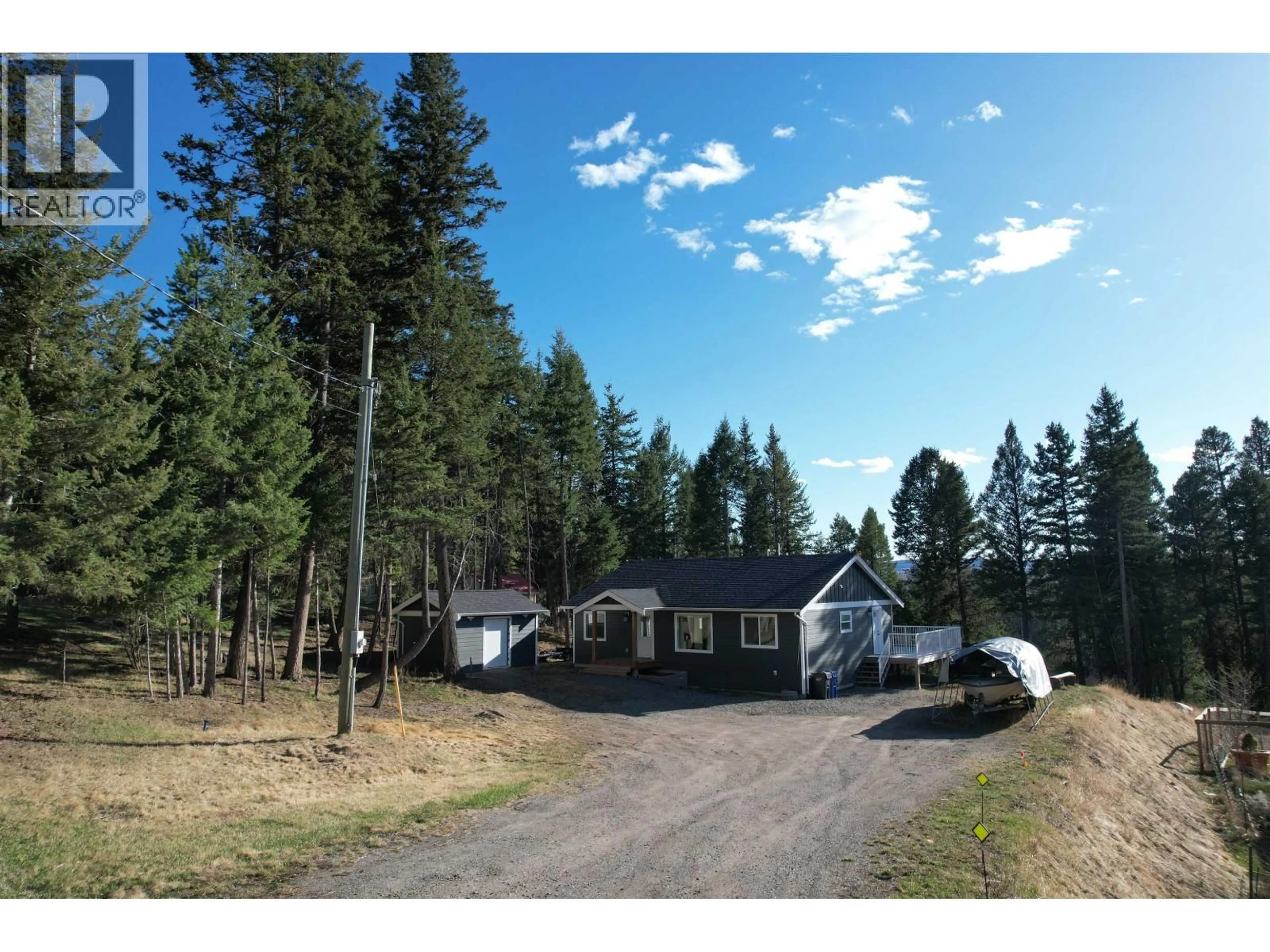 A pic from outside/outdoor area/front of a property/back of a property/a pic from drone, unknown for 4942 KYLLO ROAD, 108 Mile Ranch British Columbia V0K2Z0