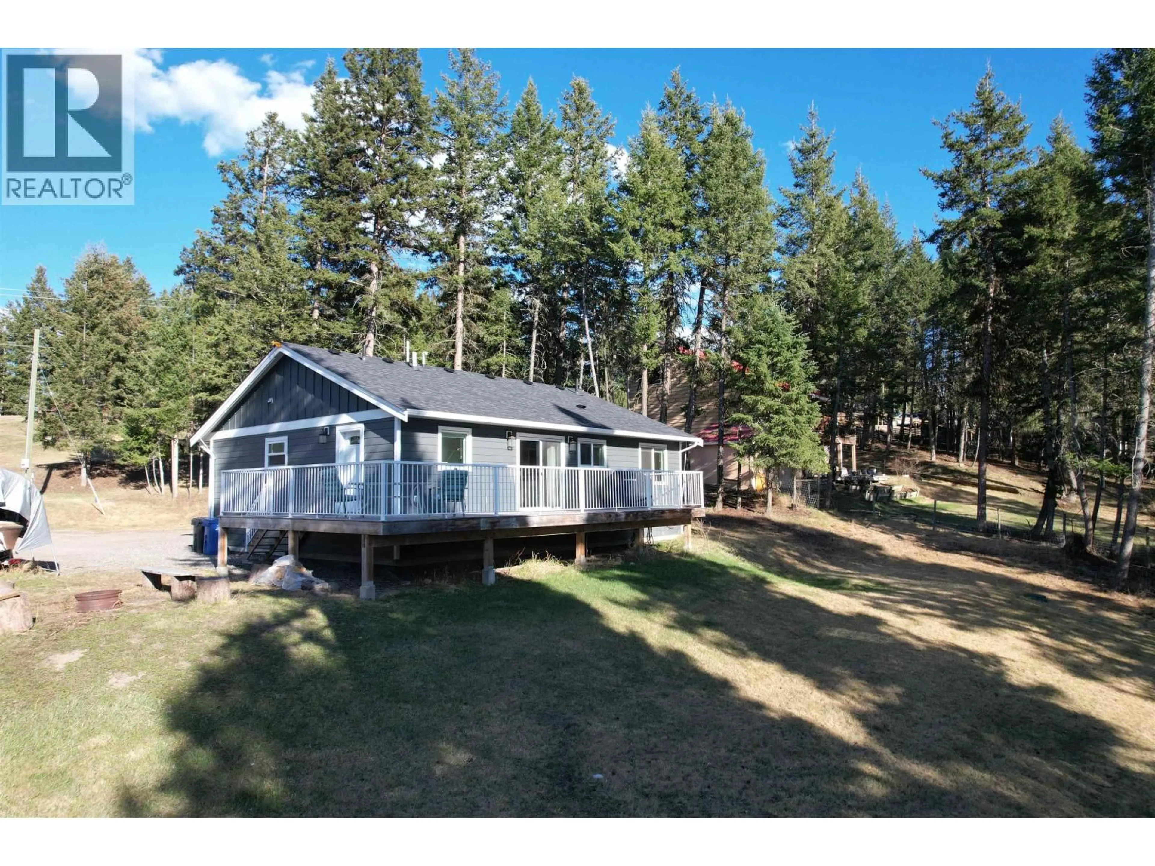 A pic from outside/outdoor area/front of a property/back of a property/a pic from drone, water/lake/river/ocean view for 4942 KYLLO ROAD, 108 Mile Ranch British Columbia V0K2Z0