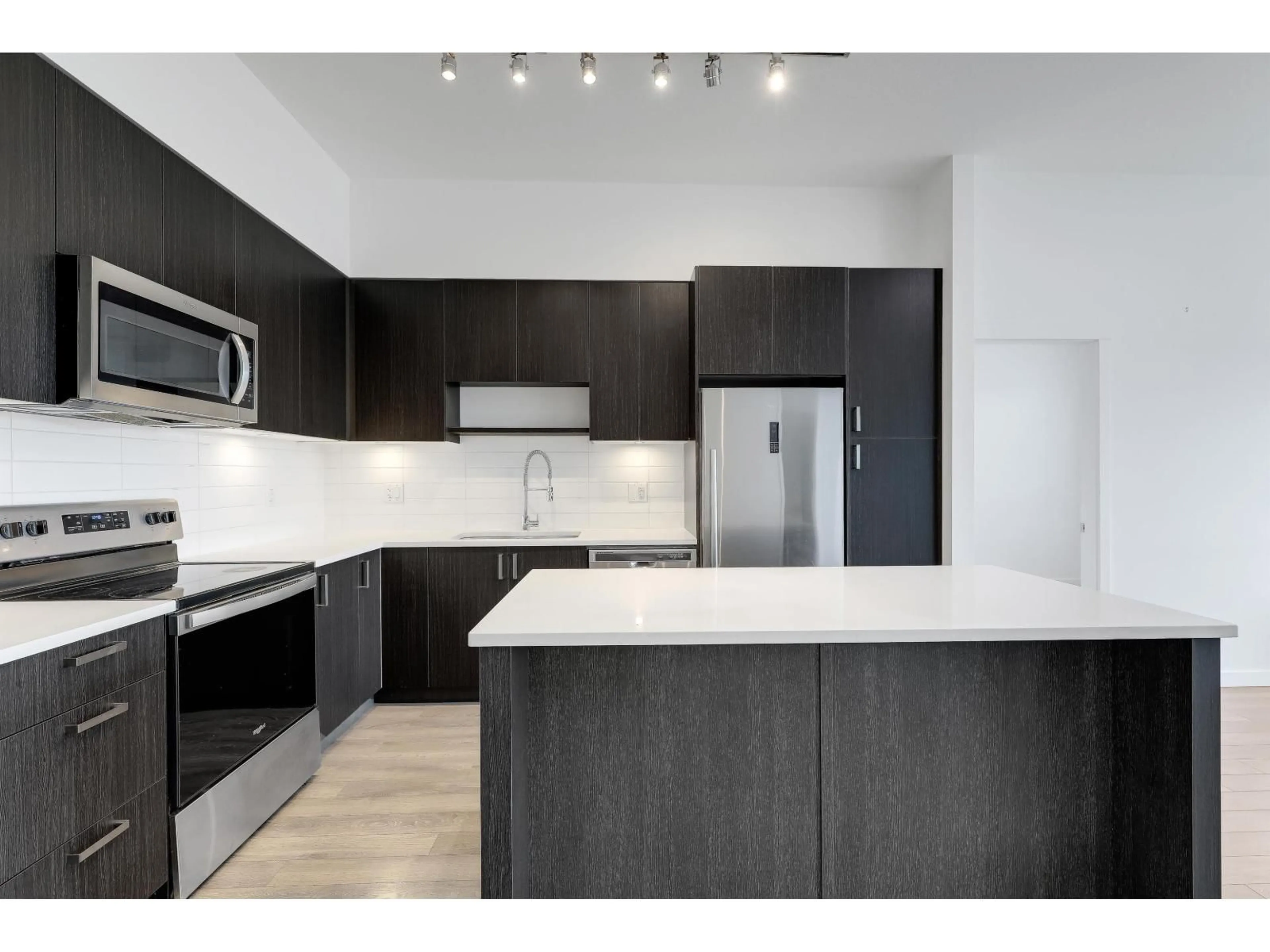 Open concept kitchen, unknown for 408 - 13628 81A AVENUE, Surrey British Columbia V3W3E2