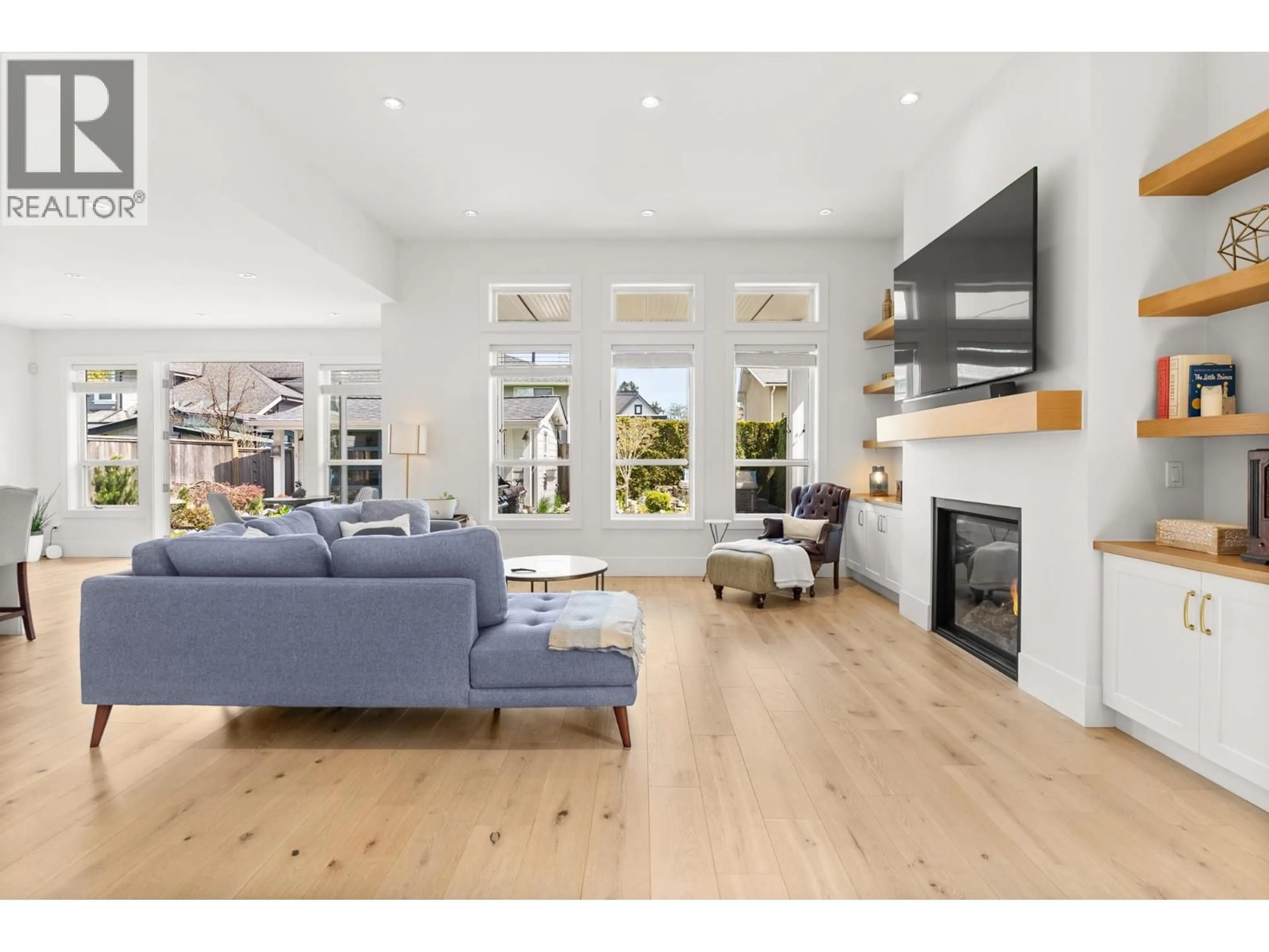 Living room with furniture, wood/laminate floor for 4410 SPANTON DRIVE, Delta British Columbia V4K2W3