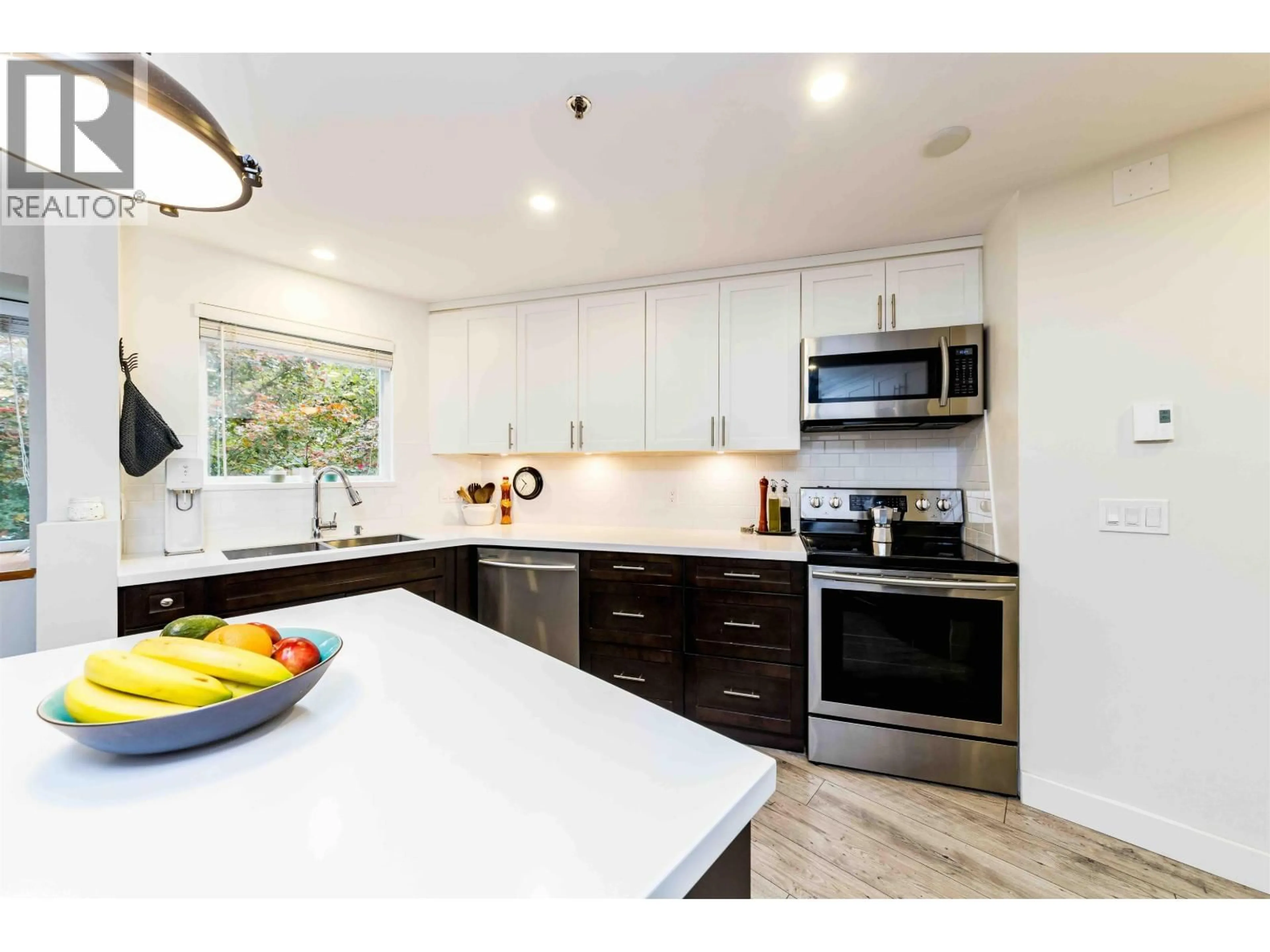 Contemporary kitchen, ceramic/tile floor for 401 - 2295 PANDORA STREET, Vancouver British Columbia V5L1N6
