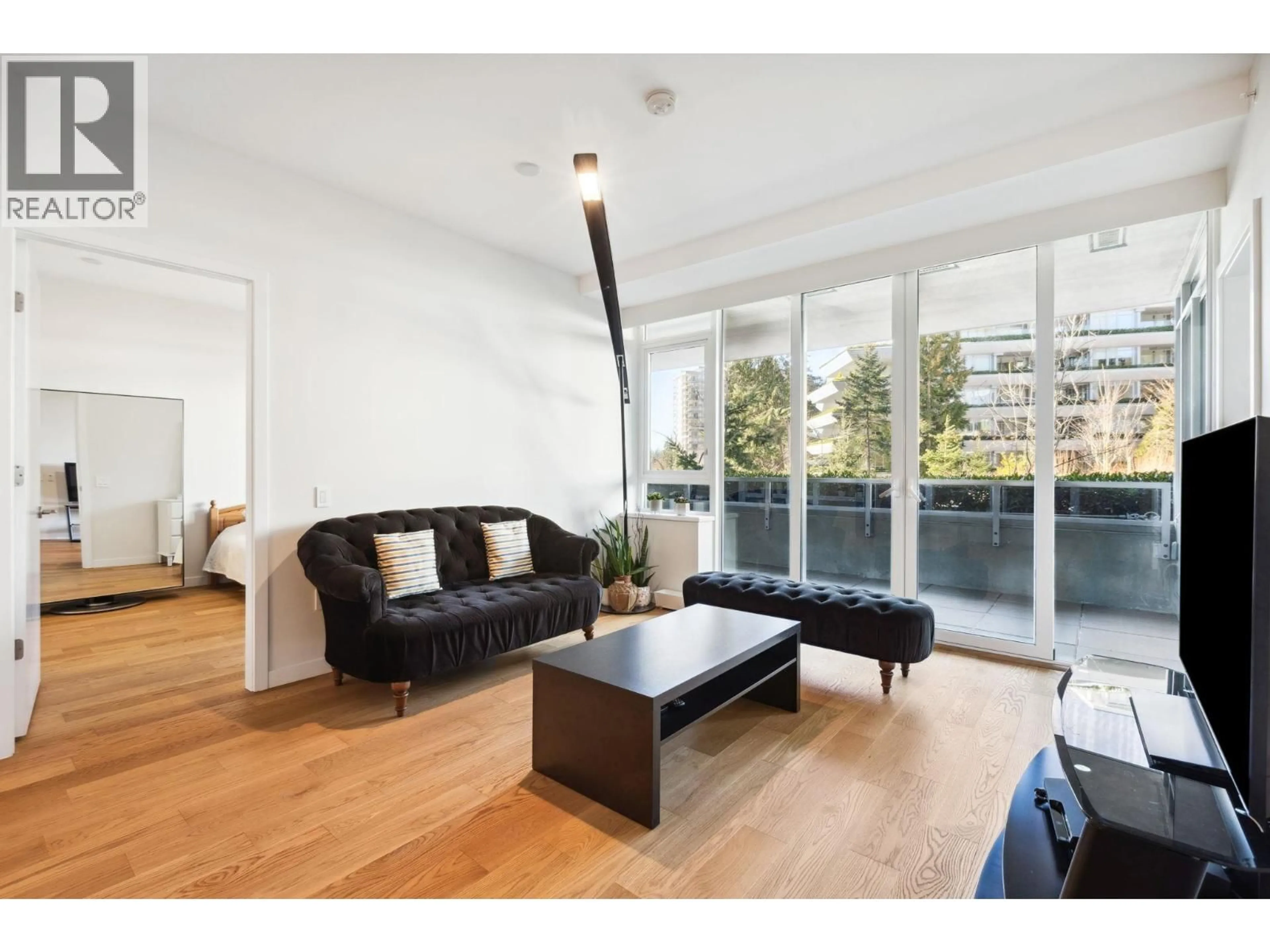 Living room with furniture, wood/laminate floor for 204 - 788 ARTHUR ERICKSON PLACE, West Vancouver British Columbia V7T0B6
