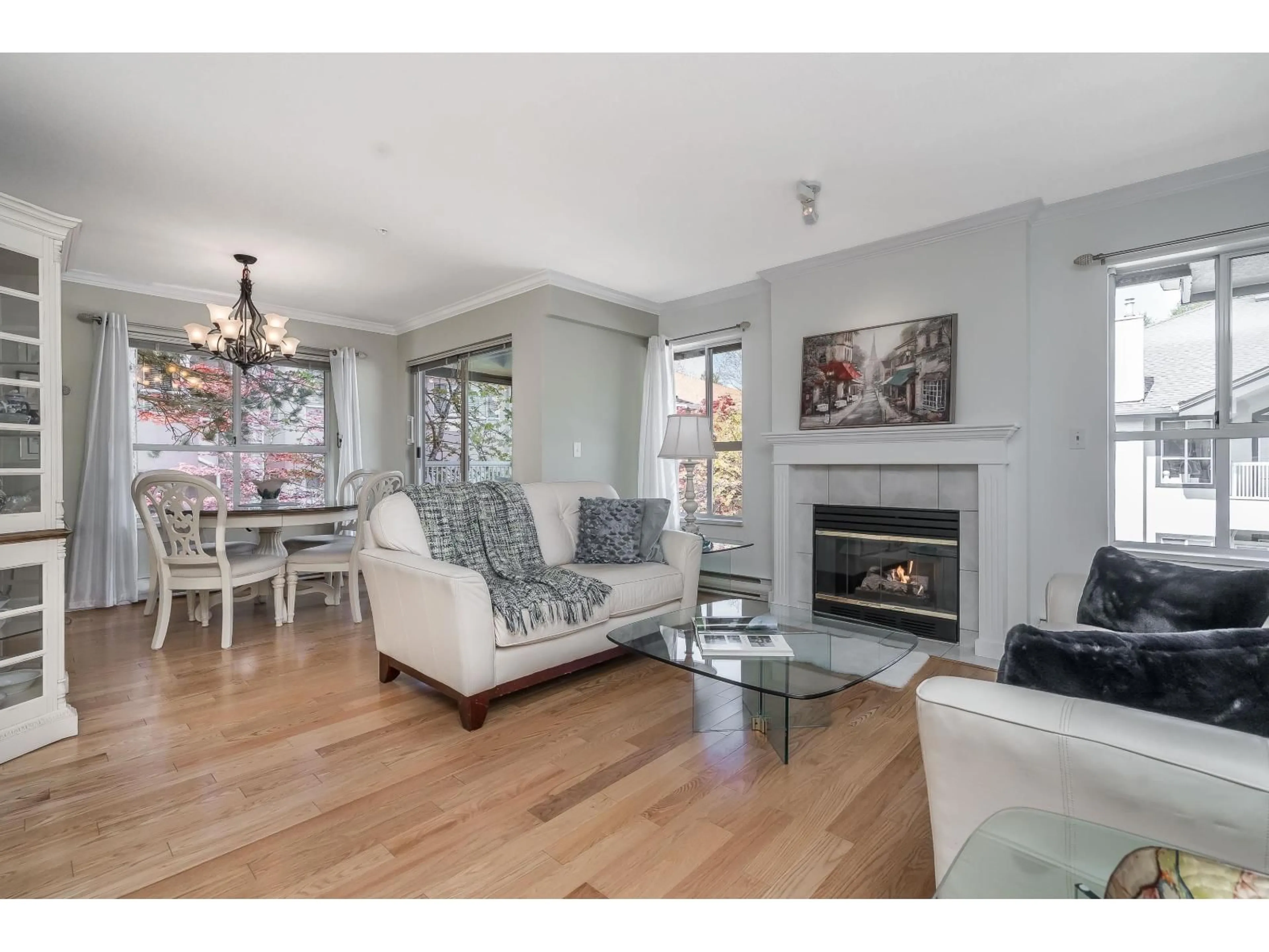 Living room with furniture, wood/laminate floor for 304 - 15272 20 AVENUE, Surrey British Columbia V4A2A3