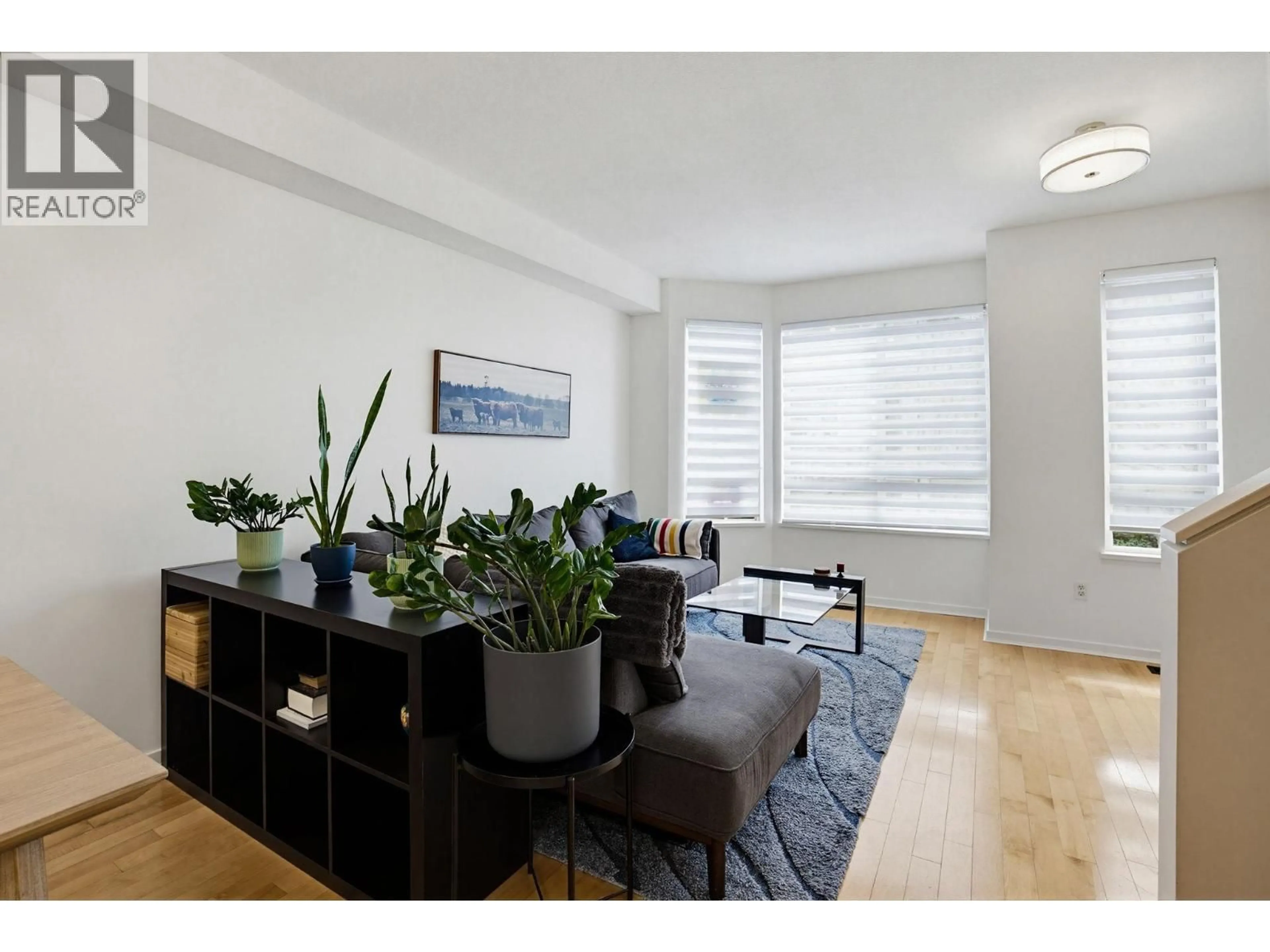 Living room with furniture, wood/laminate floor for 16 - 100 KLAHANIE DRIVE, Port Moody British Columbia V3H5K3