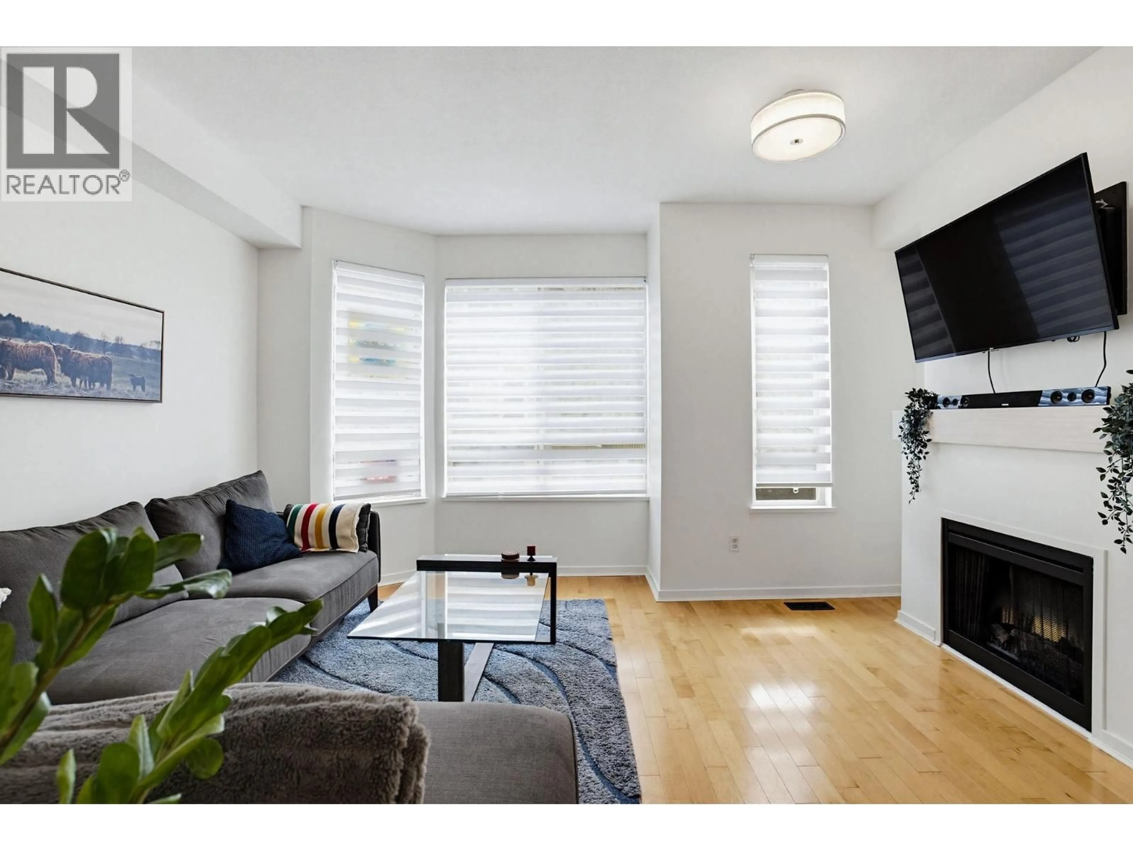 Living room with furniture, wood/laminate floor for 16 - 100 KLAHANIE DRIVE, Port Moody British Columbia V3H5K3