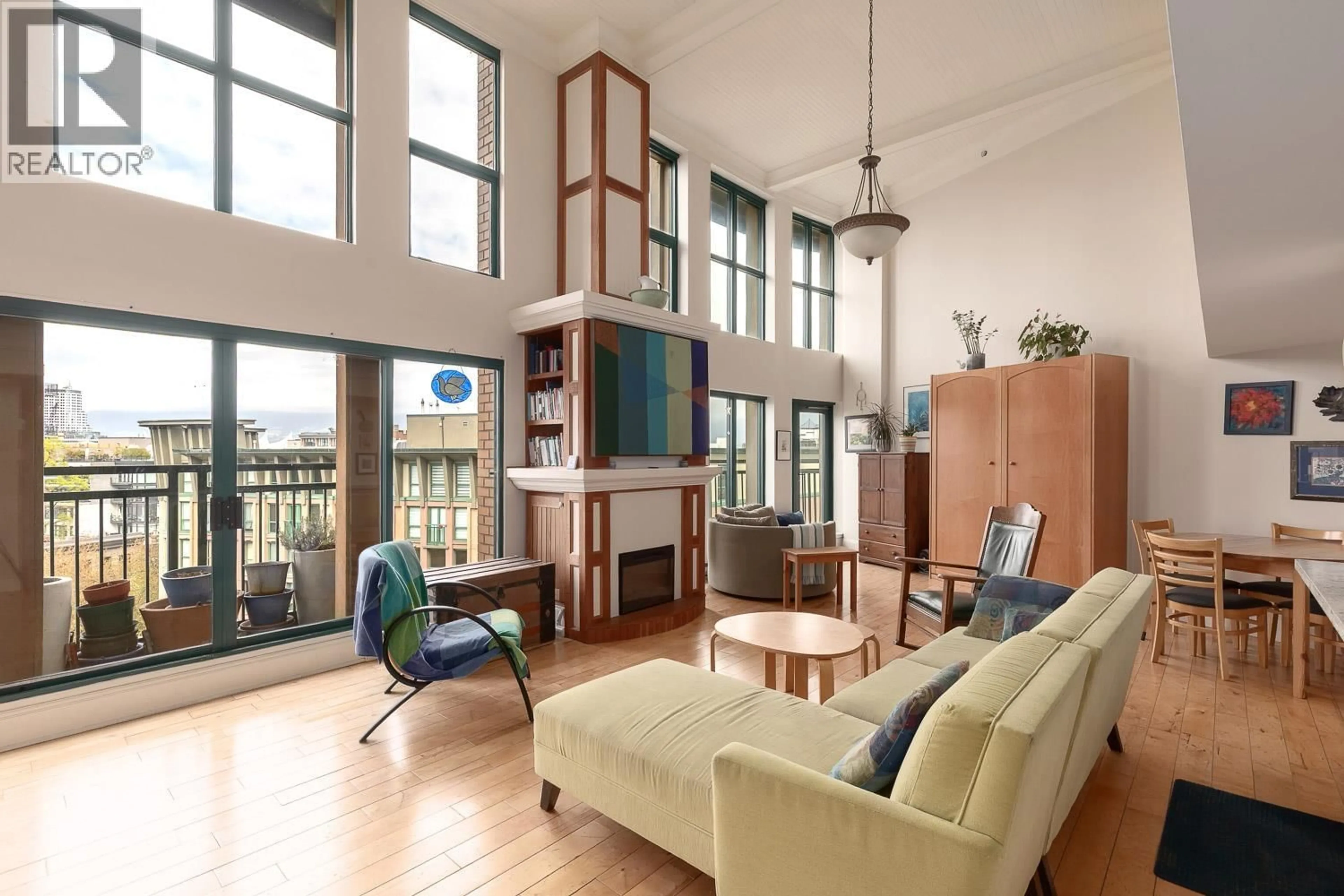 Living room with furniture, wood/laminate floor for 607 - 22 CORDOVA STREET, Vancouver British Columbia V6A4G8