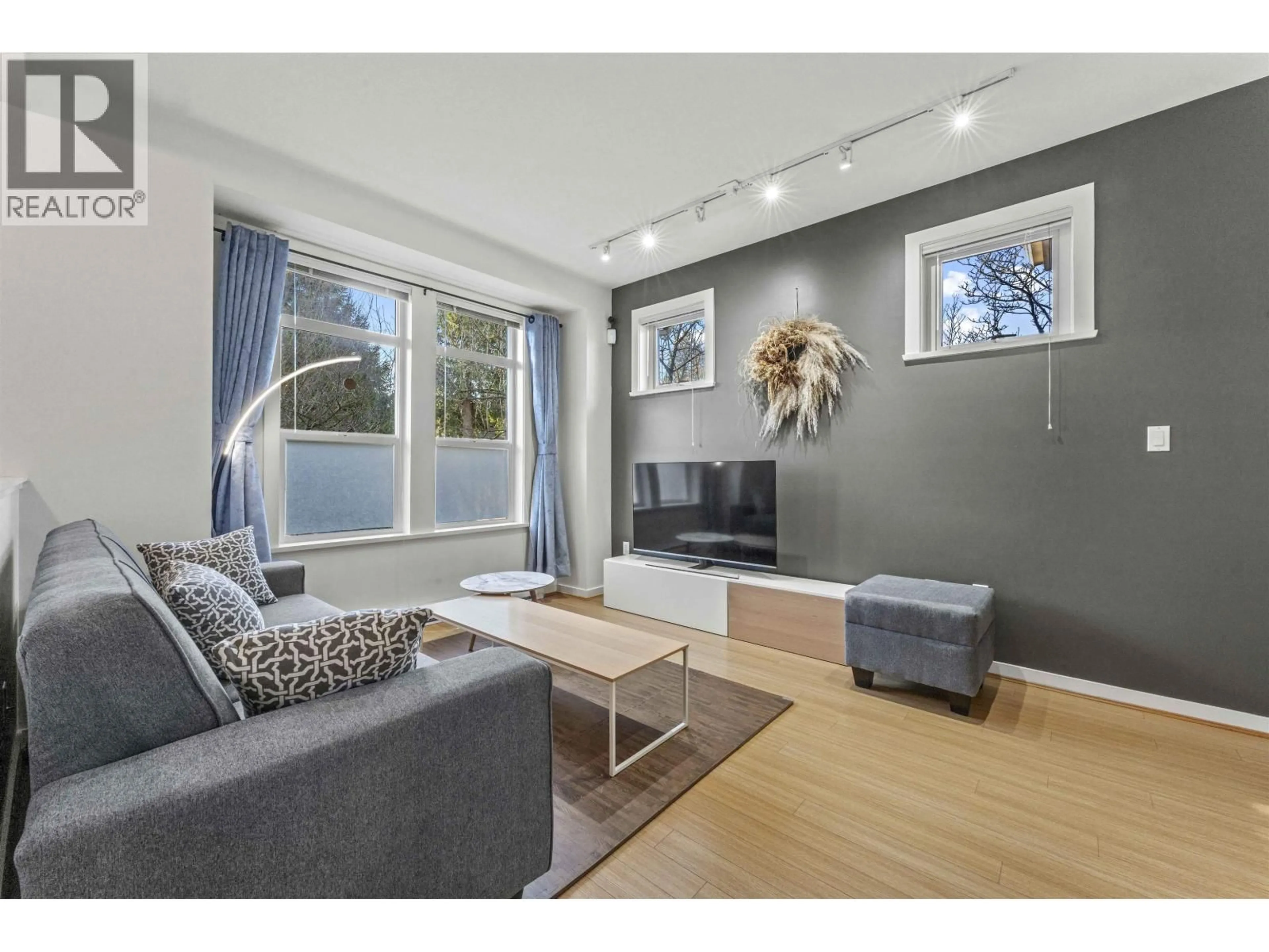 Living room with furniture, wood/laminate floor for 15 - 5771 IRMIN STREET, Burnaby British Columbia V5J0C5