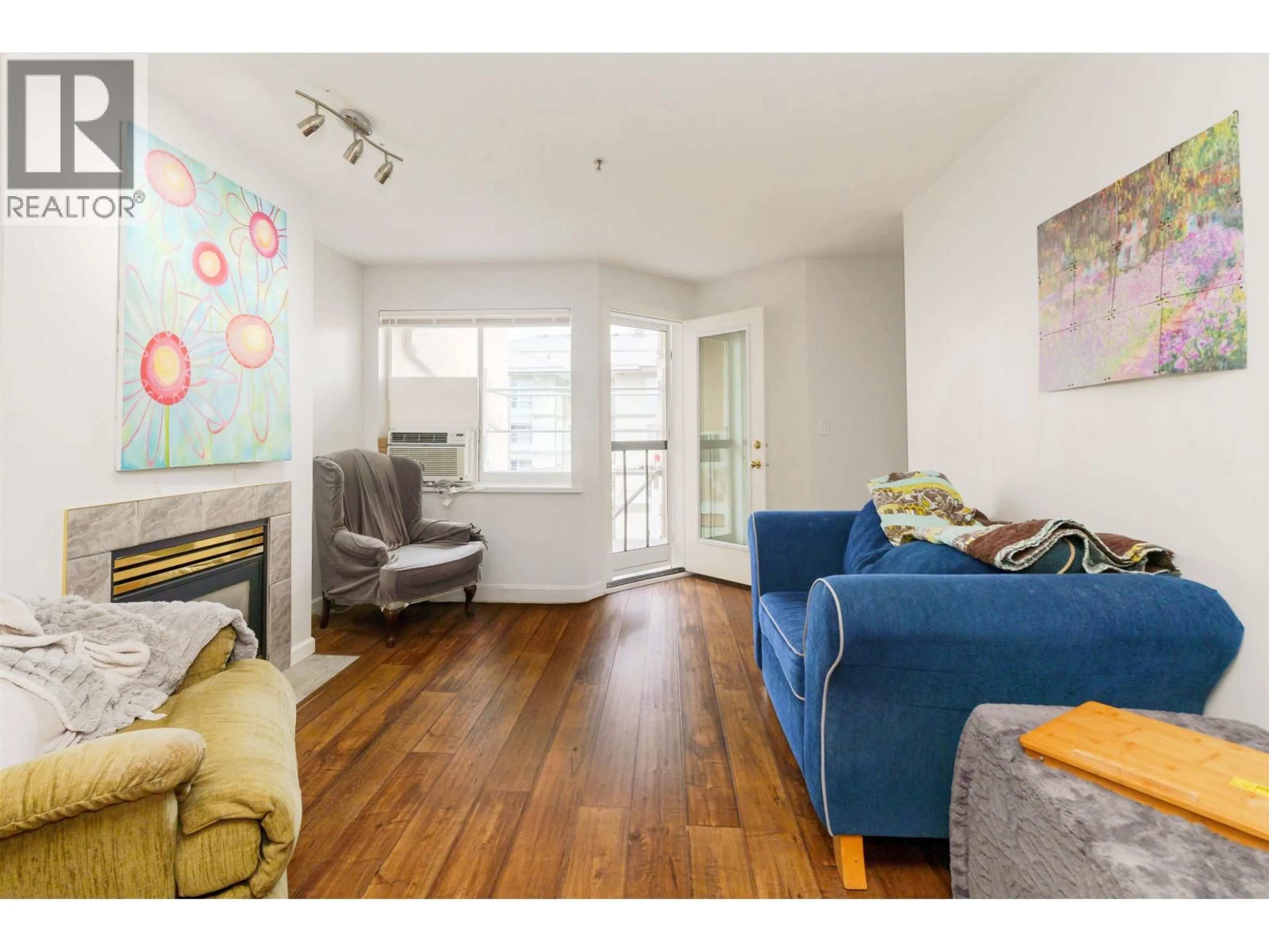 Living room with furniture, wood/laminate floor for 404 - 22351 ST ANNE AVENUE, Maple Ridge British Columbia V2X2E7