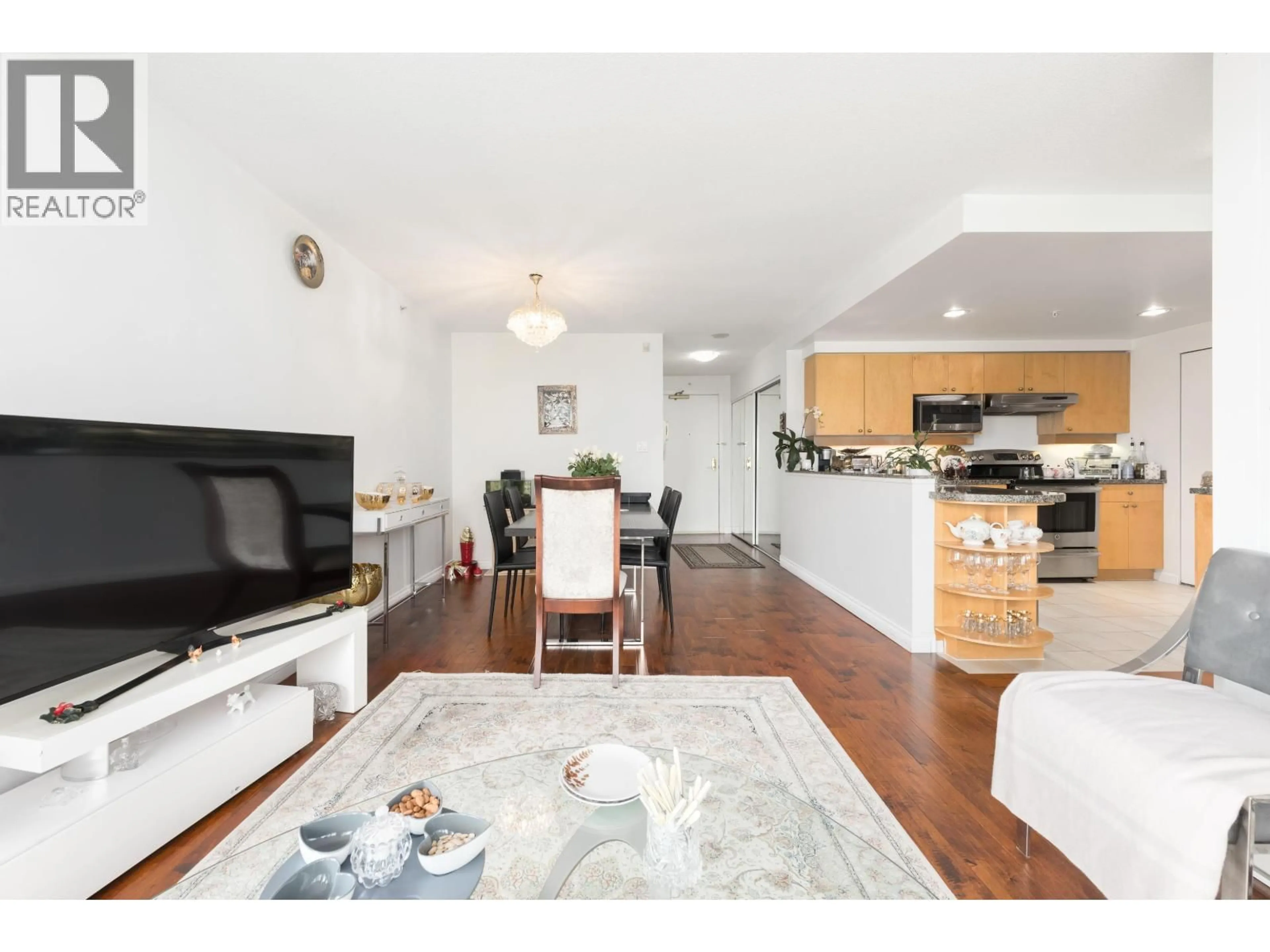 Living room with furniture, wood/laminate floor for 1201 - 1228 MARINASIDE CRESCENT, Vancouver British Columbia V6Z2W4