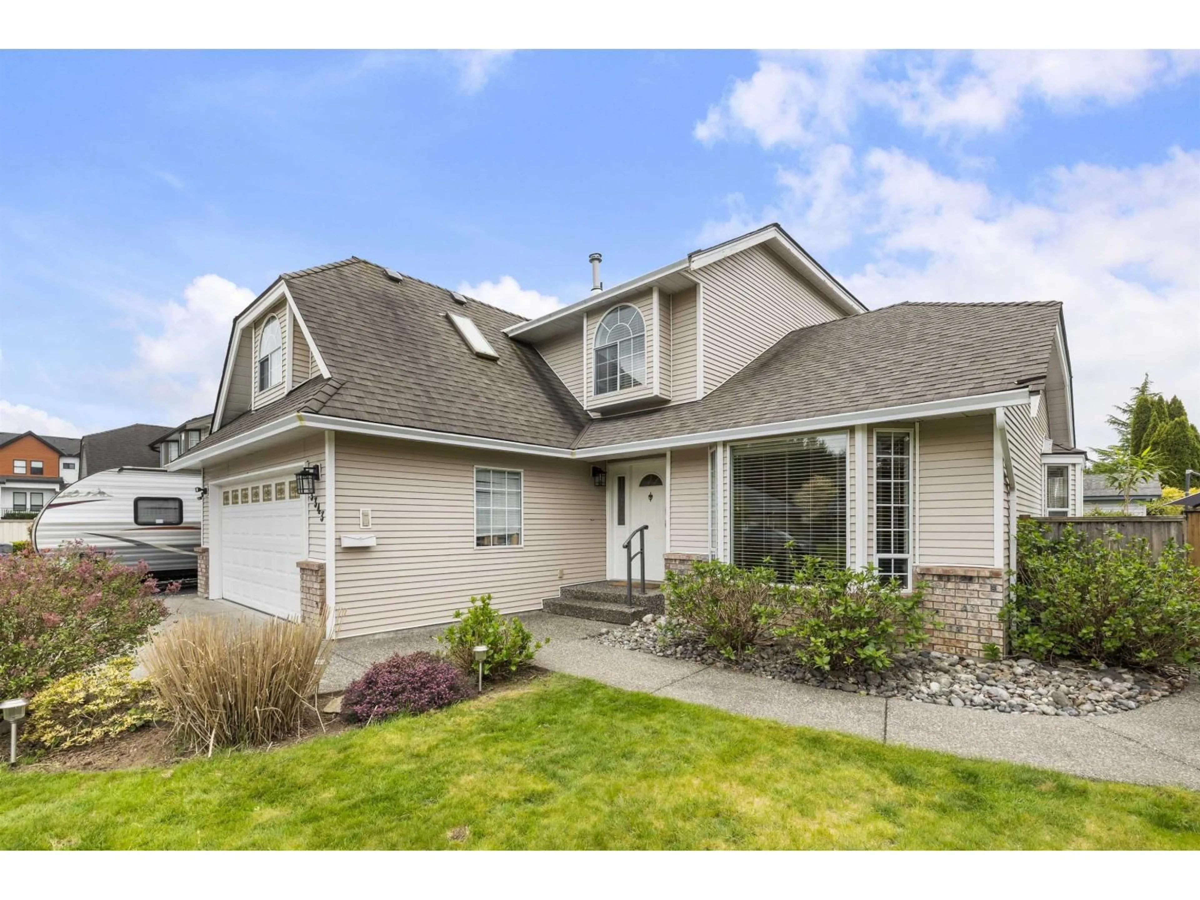 Home with vinyl exterior material, street for 3343 197A STREET, Langley British Columbia V3A7Y7