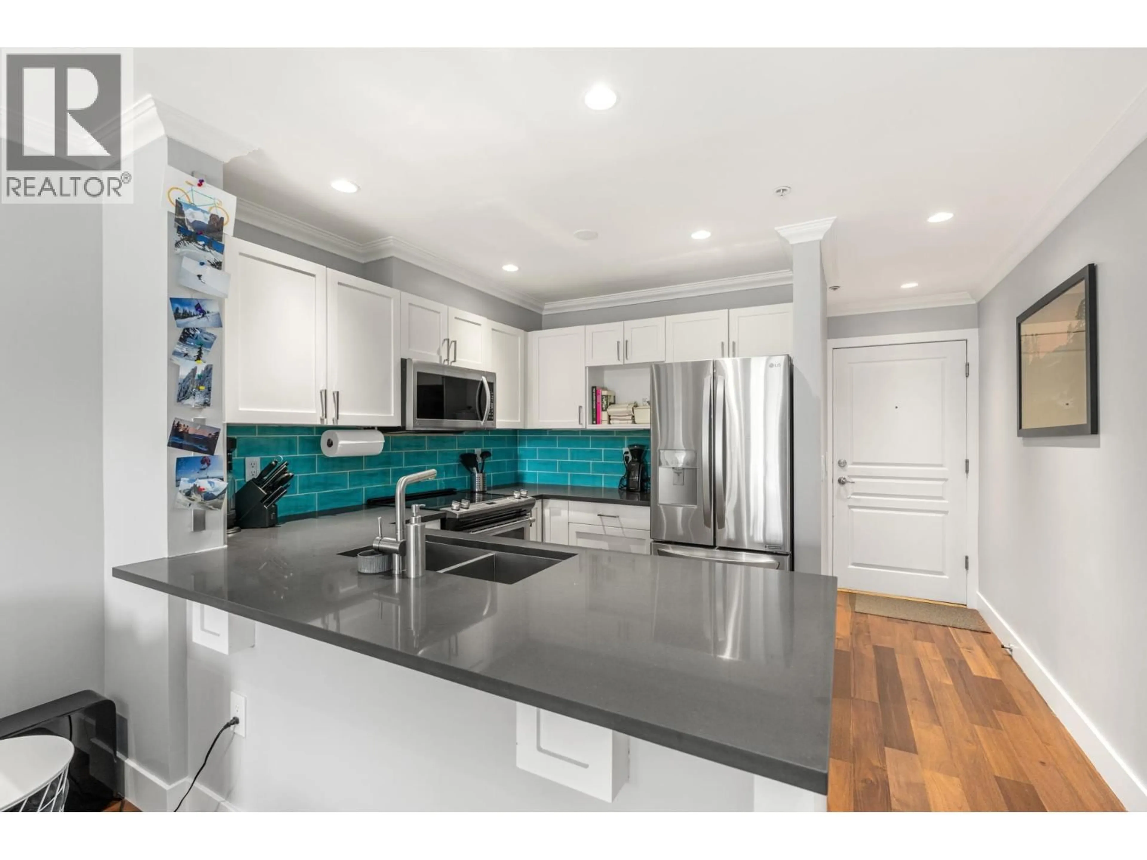 Open concept kitchen, unknown for 105 - 365 1ST STREET, North Vancouver British Columbia V7L4W5