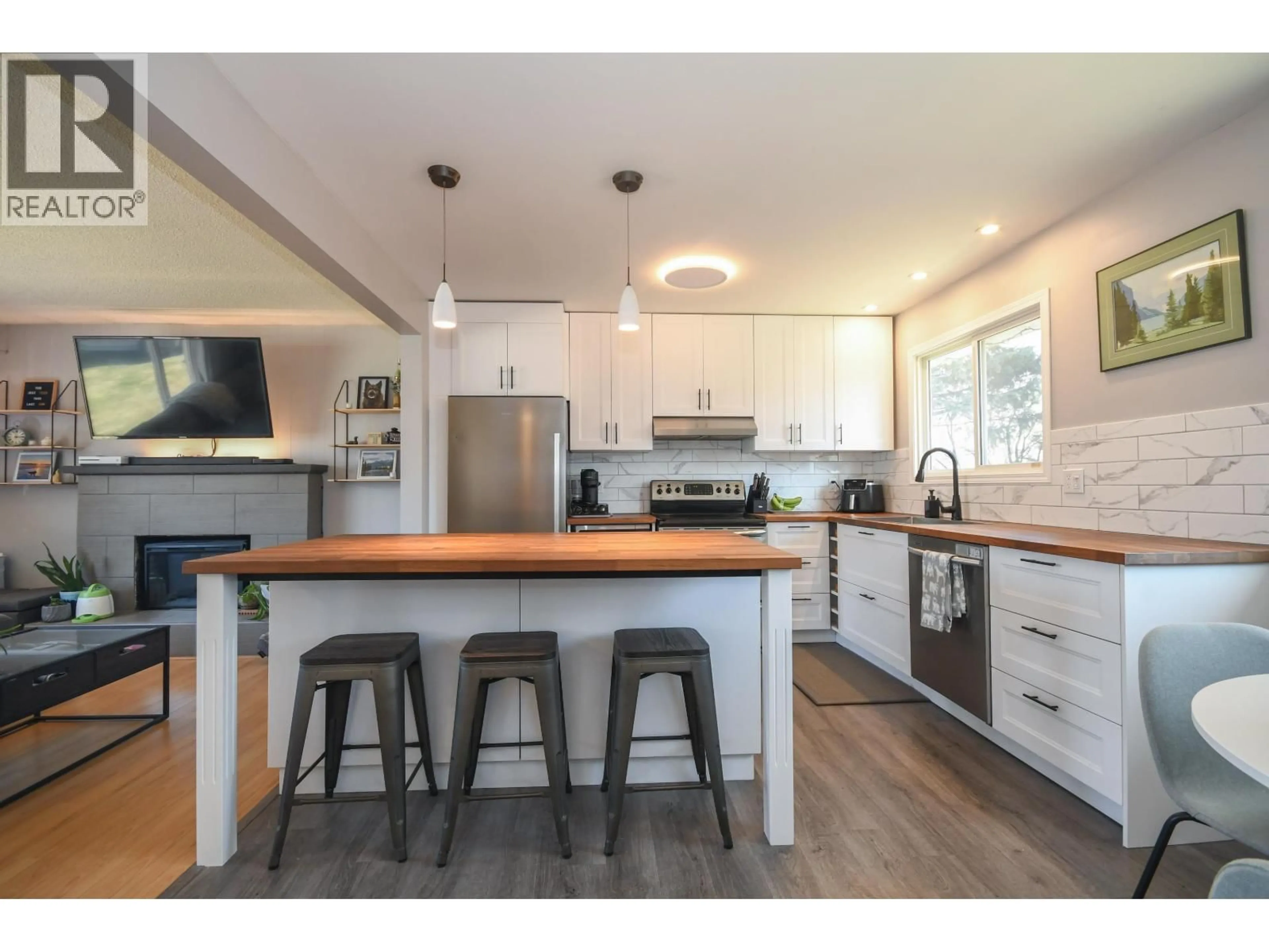 Open concept kitchen, wood/laminate floor for 6033 SELKIRK CRESCENT, Prince George British Columbia V2N2G9
